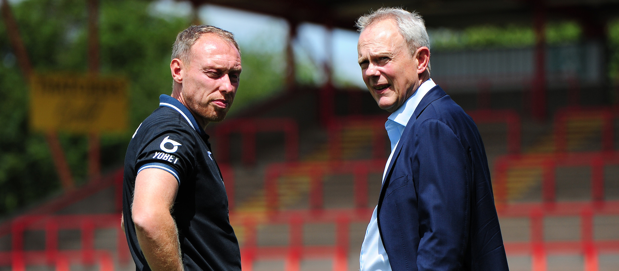 Head coach Steve Cooper speaks with chairman Trevor Birch.