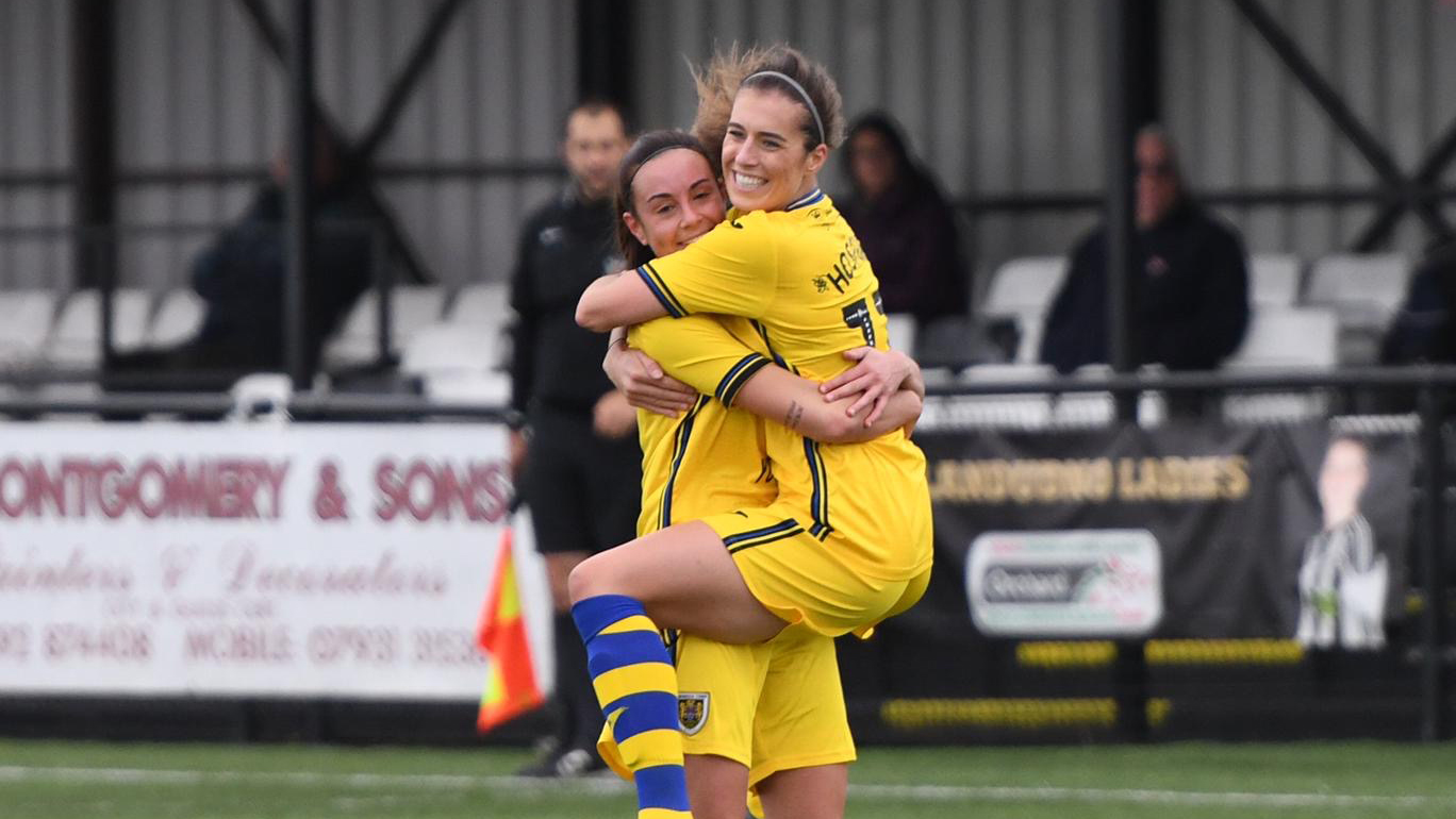 Alicia Powe and Katy Hosford celebrate.