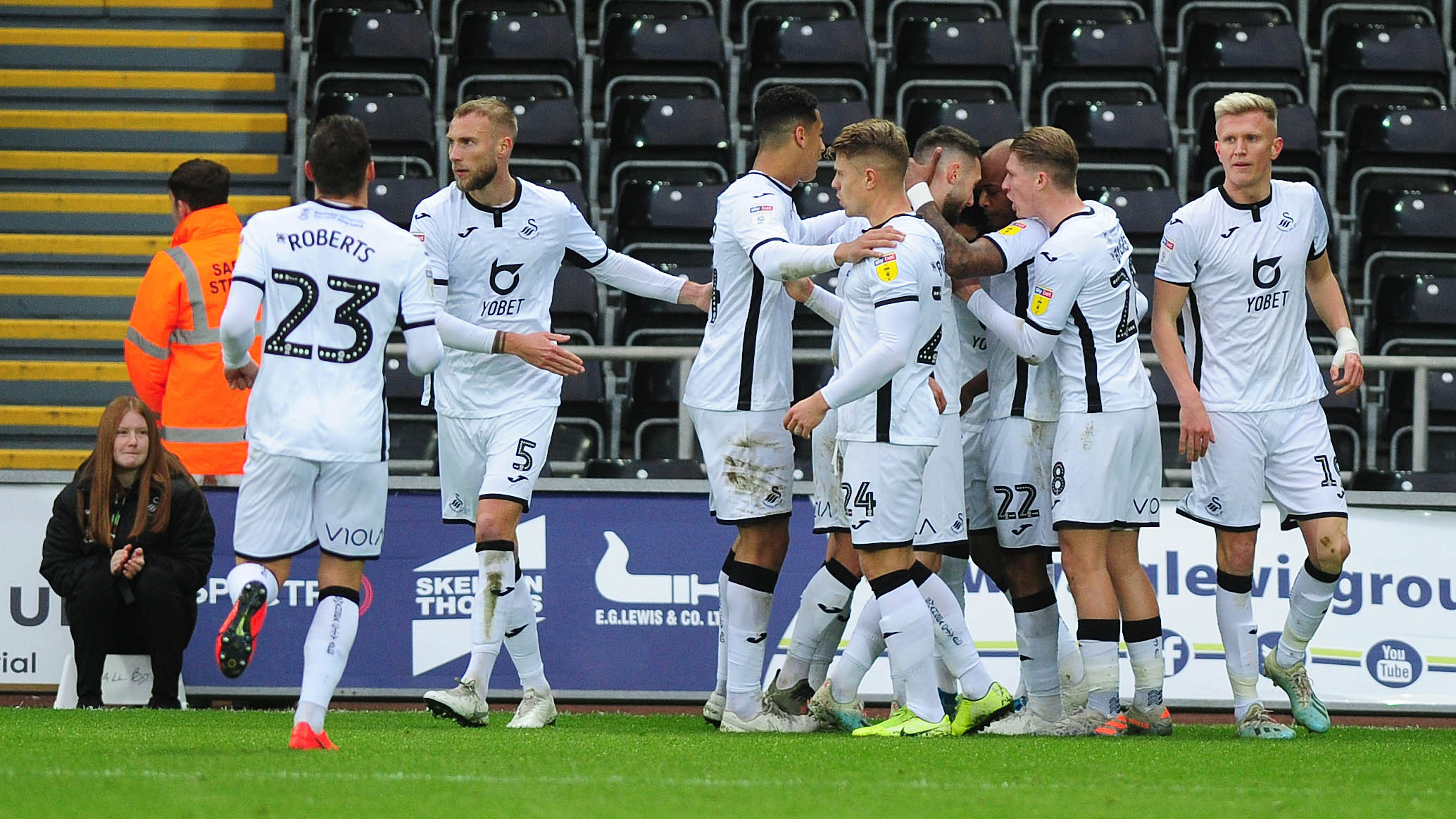 The Swans squad celebrate a goal