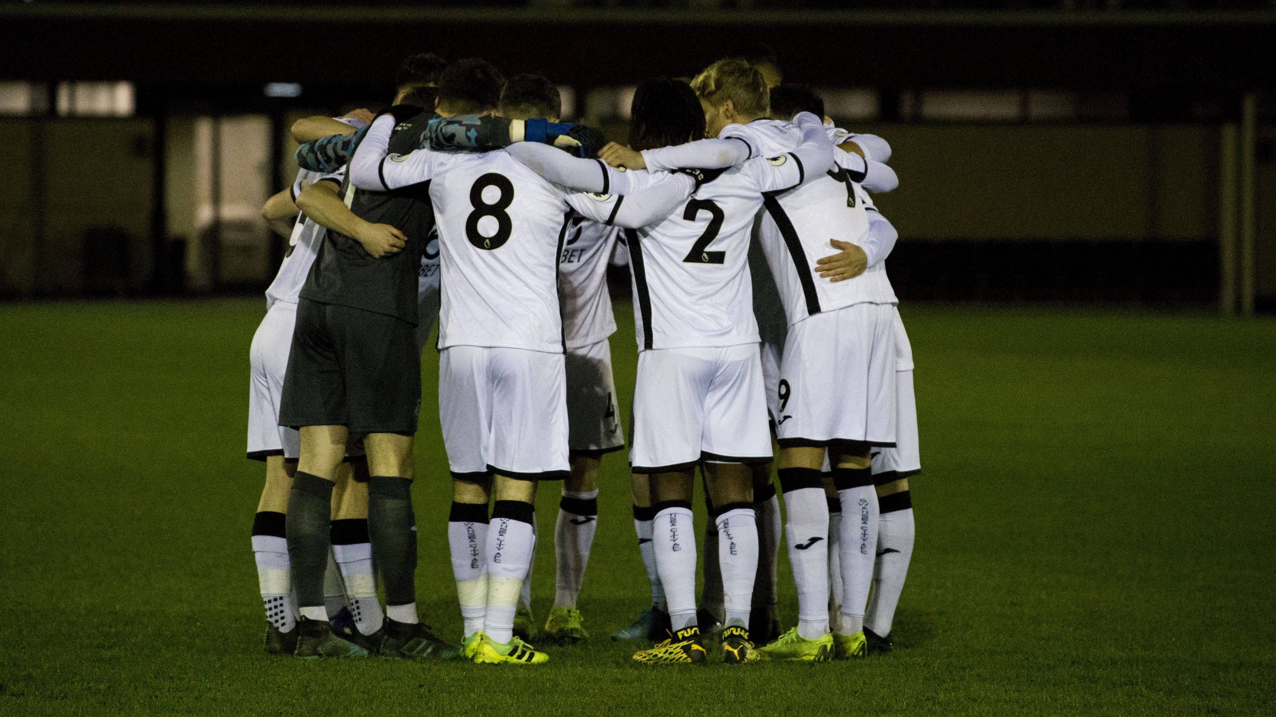 Under-23s huddle