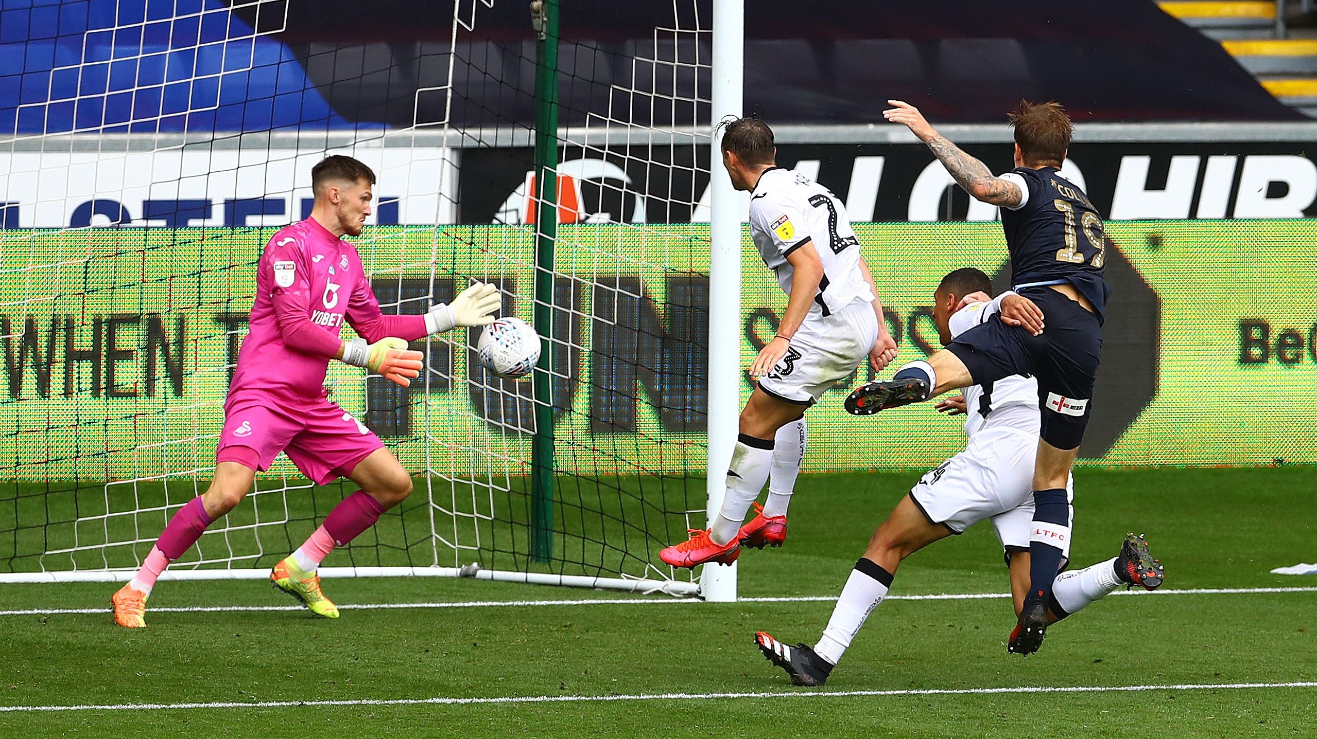 Luton Collins scores past Woodman