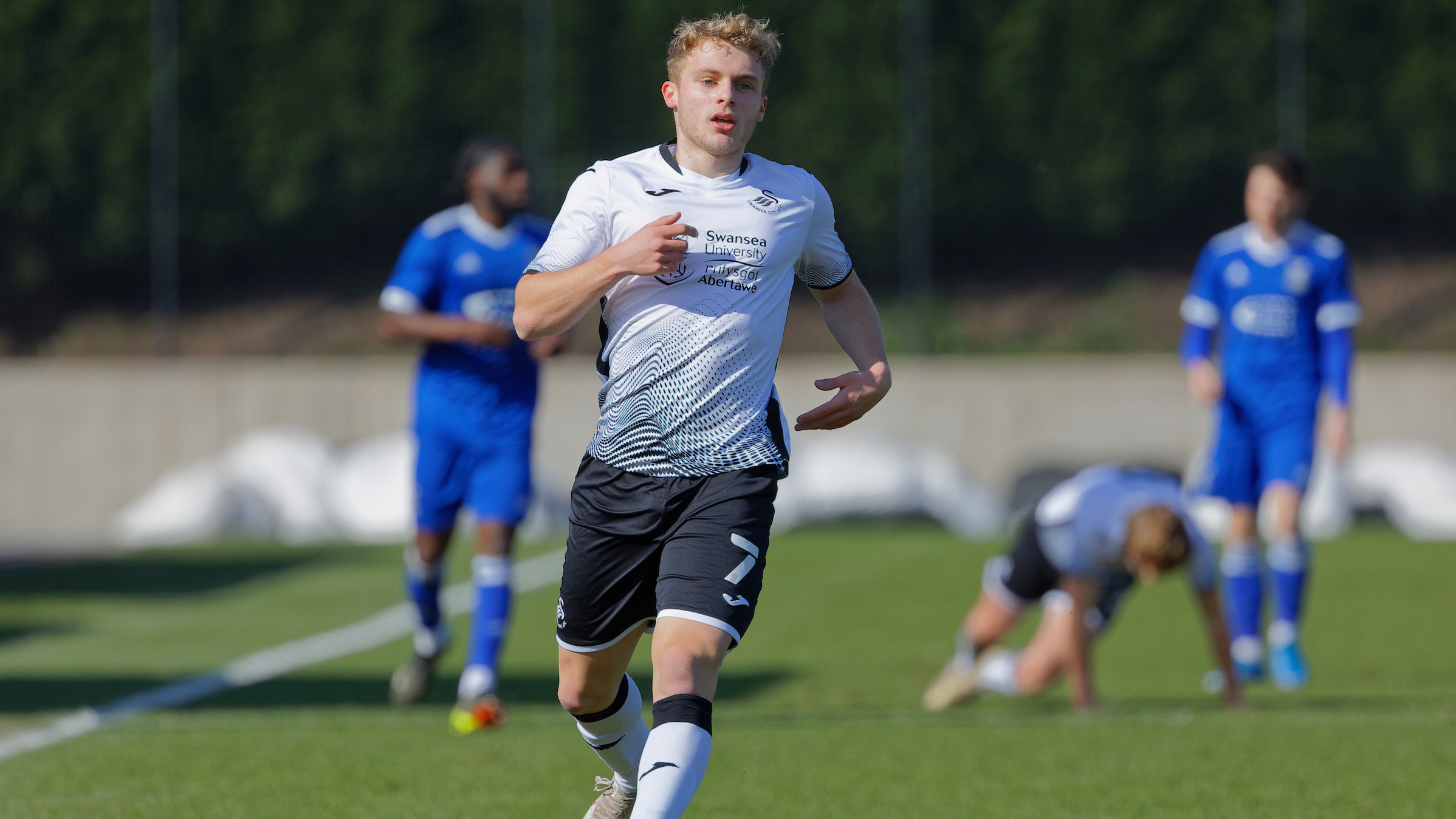 Swansea, Wales. 4 February 2023. Geoffroy Bony of Swansea City battles for  possession with Kyron Horsley-McKay of Millwall during the Professional  Development League game between Swansea City Under 18 and Millwall Under