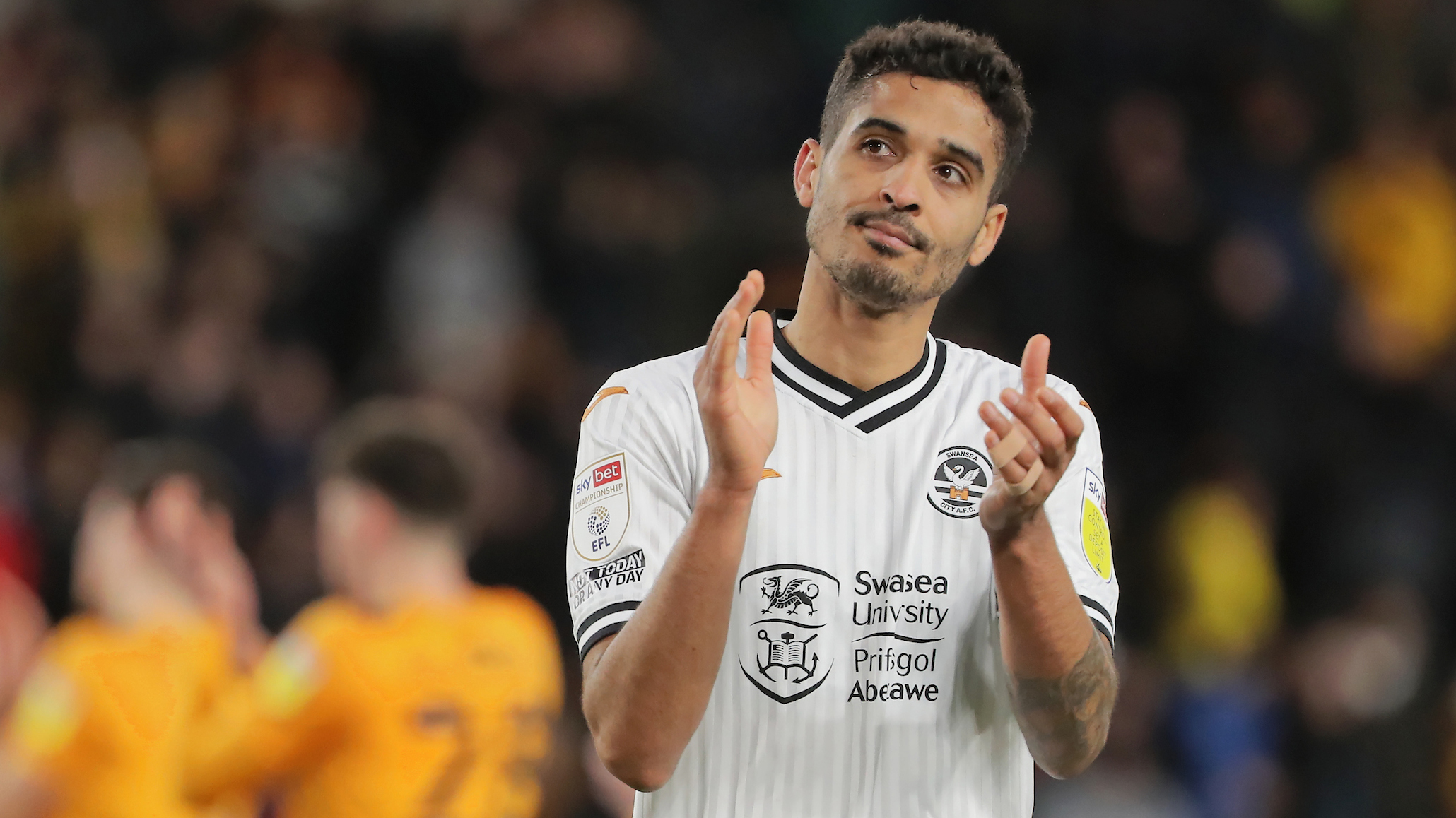 Kyle Naughton claps fans