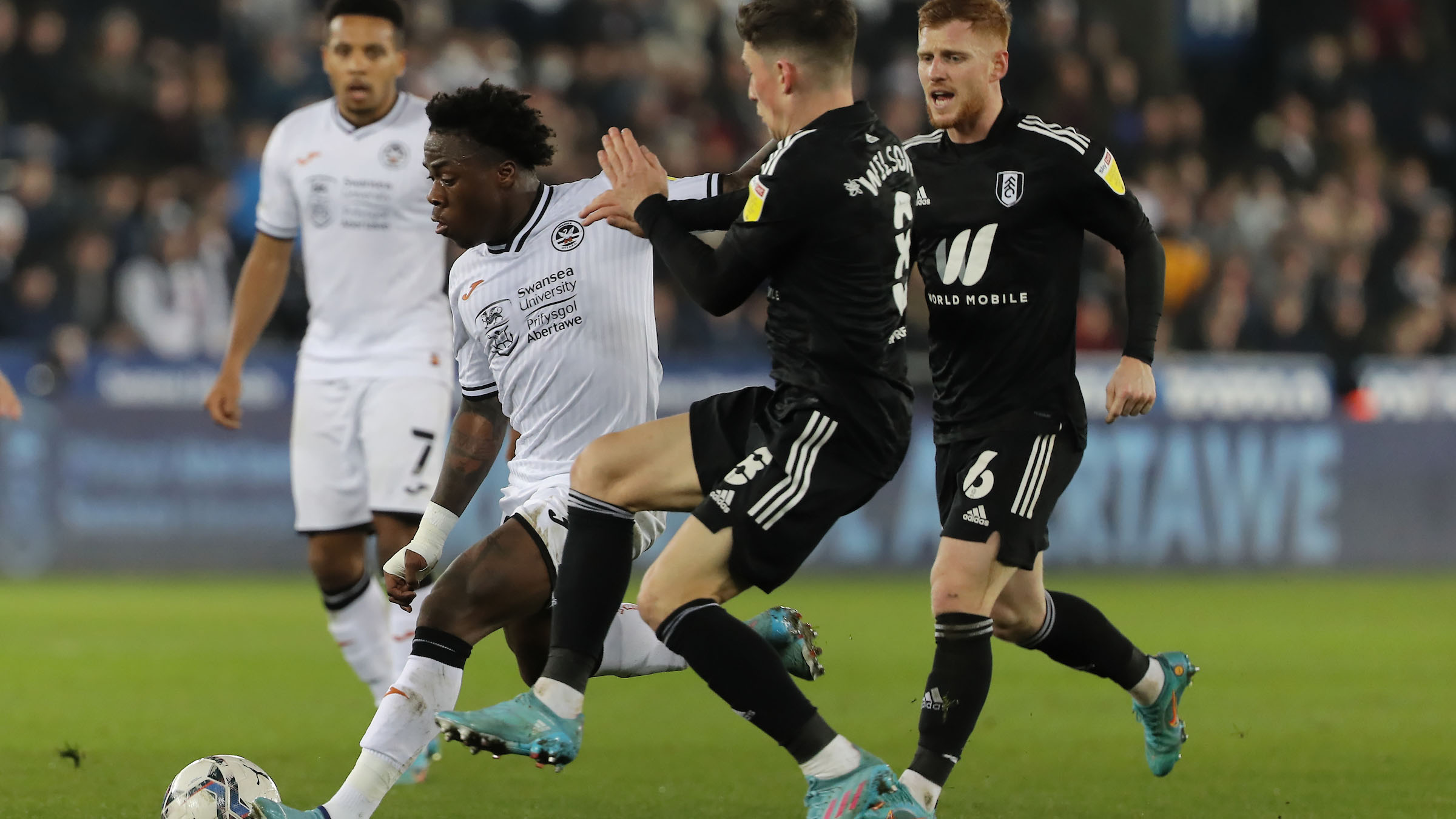 Michael Obafemi holds off Fulham's Harry Wilson