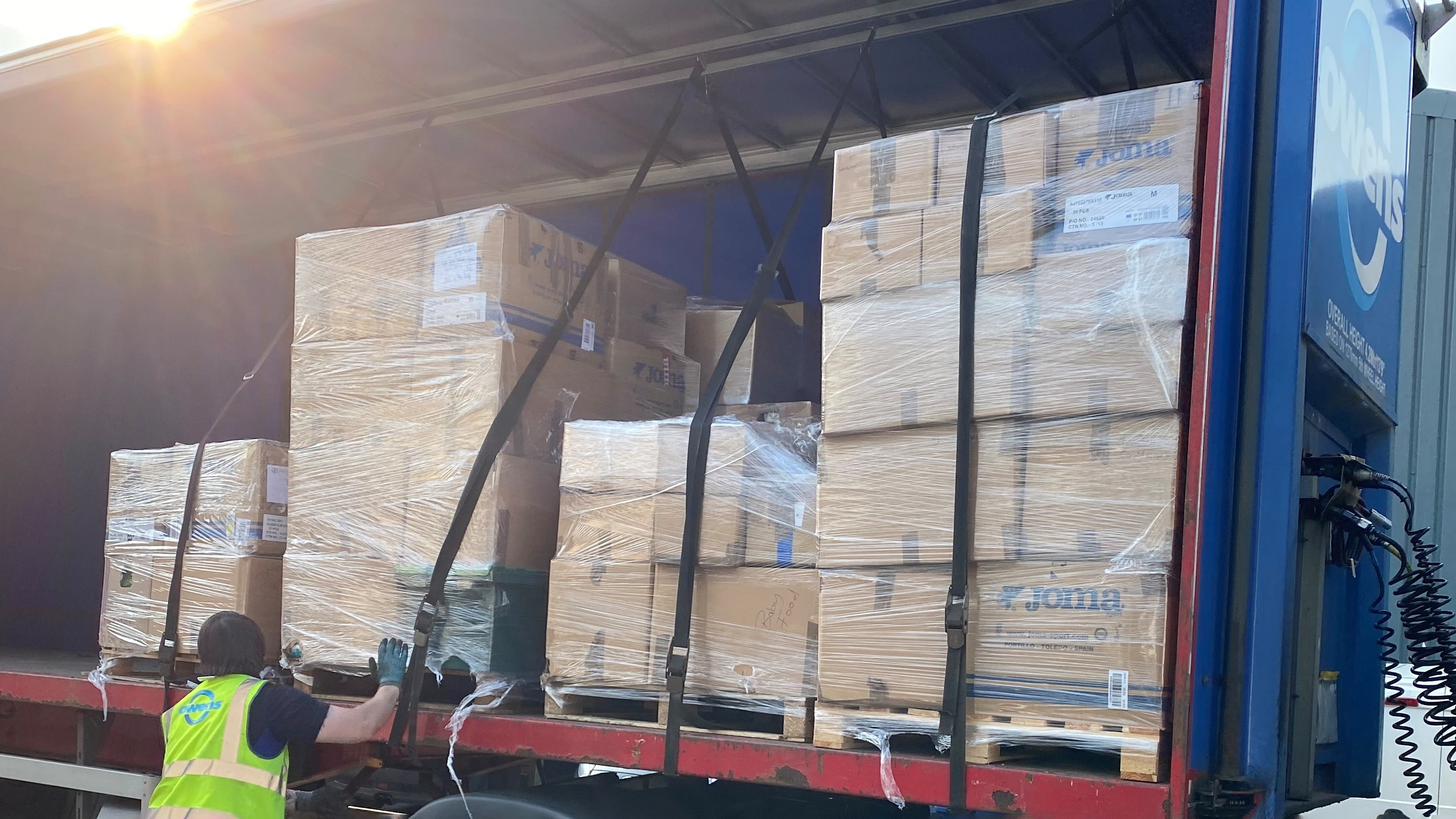 Owens worker putting boxes onto a lorry