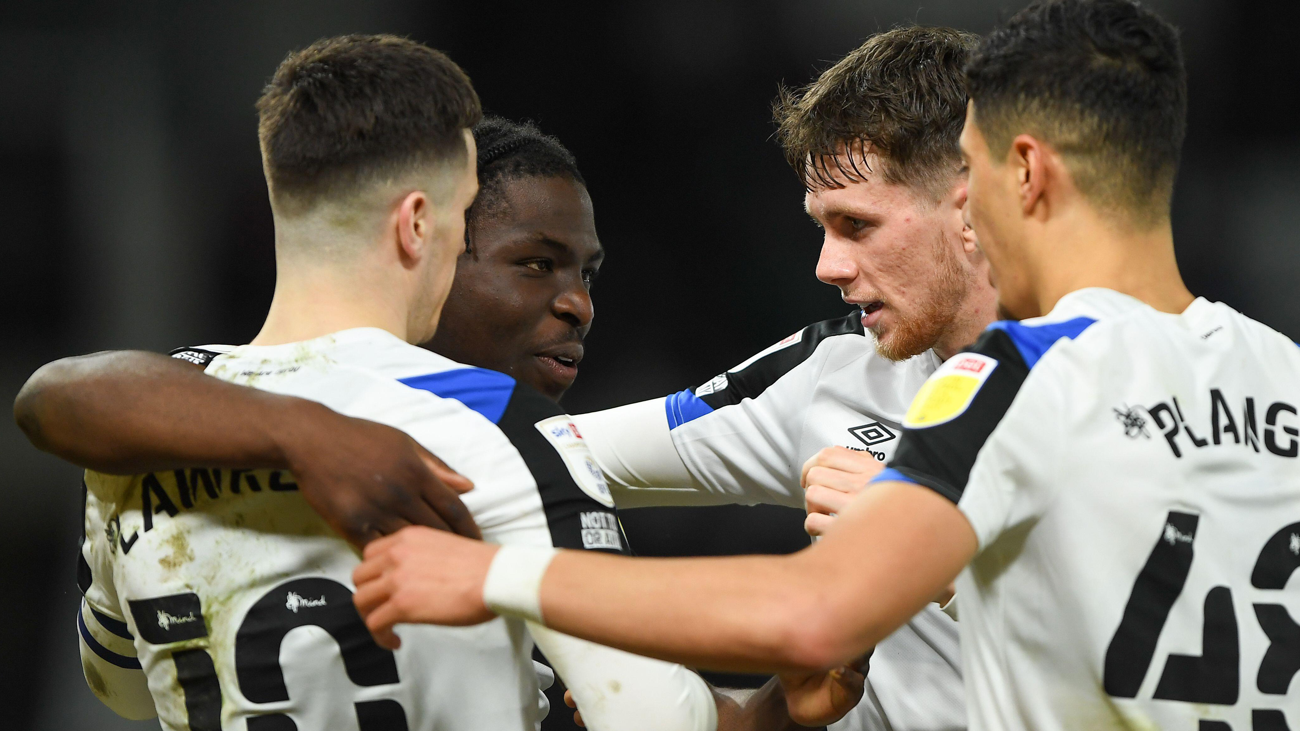 Derby County players celebrate a goal