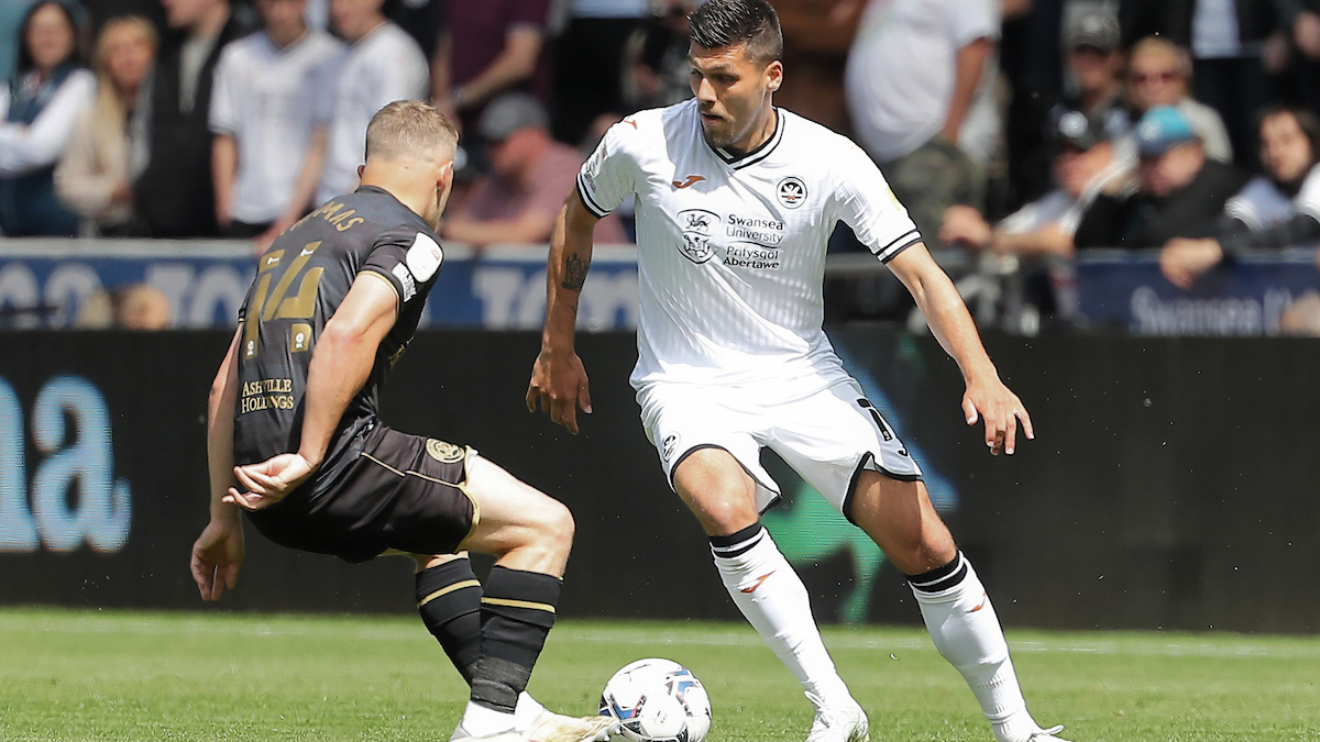 Joel Piroe takes on a QPR player 