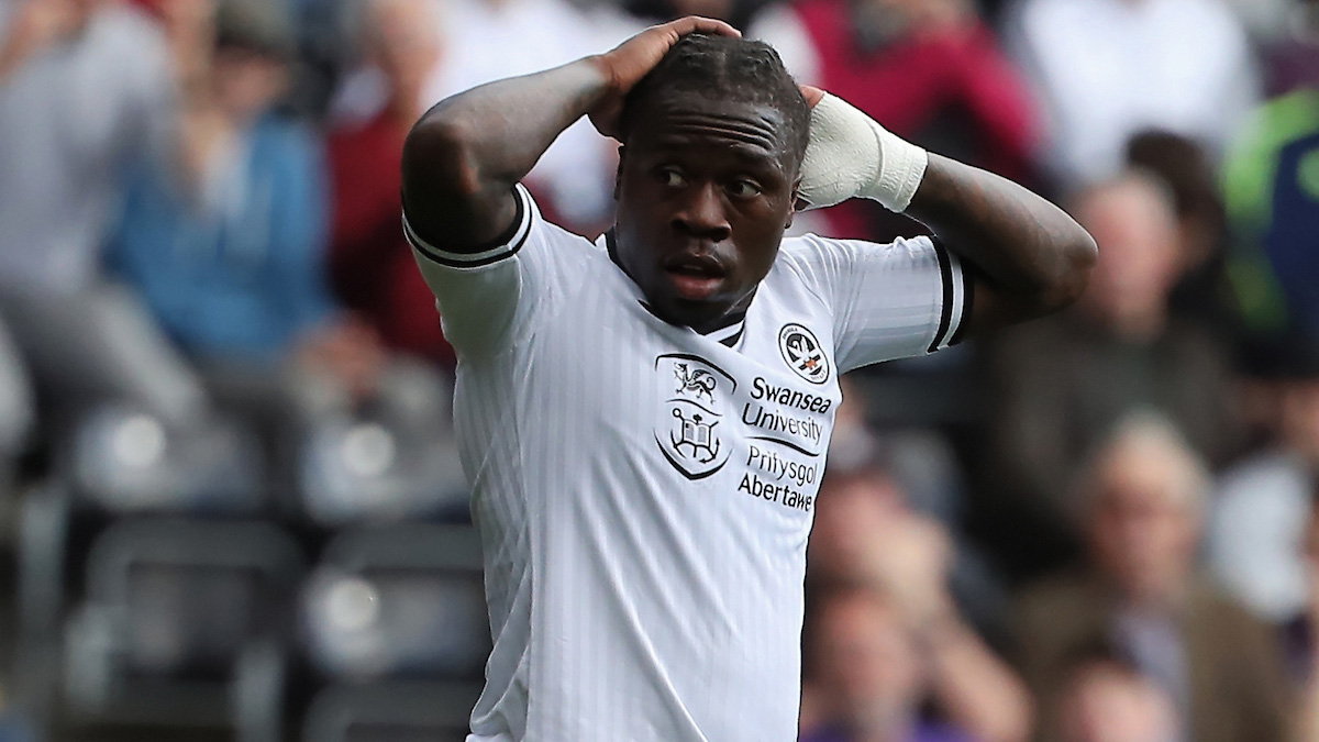 Michael Obafemi has his hands on his head in disbelief