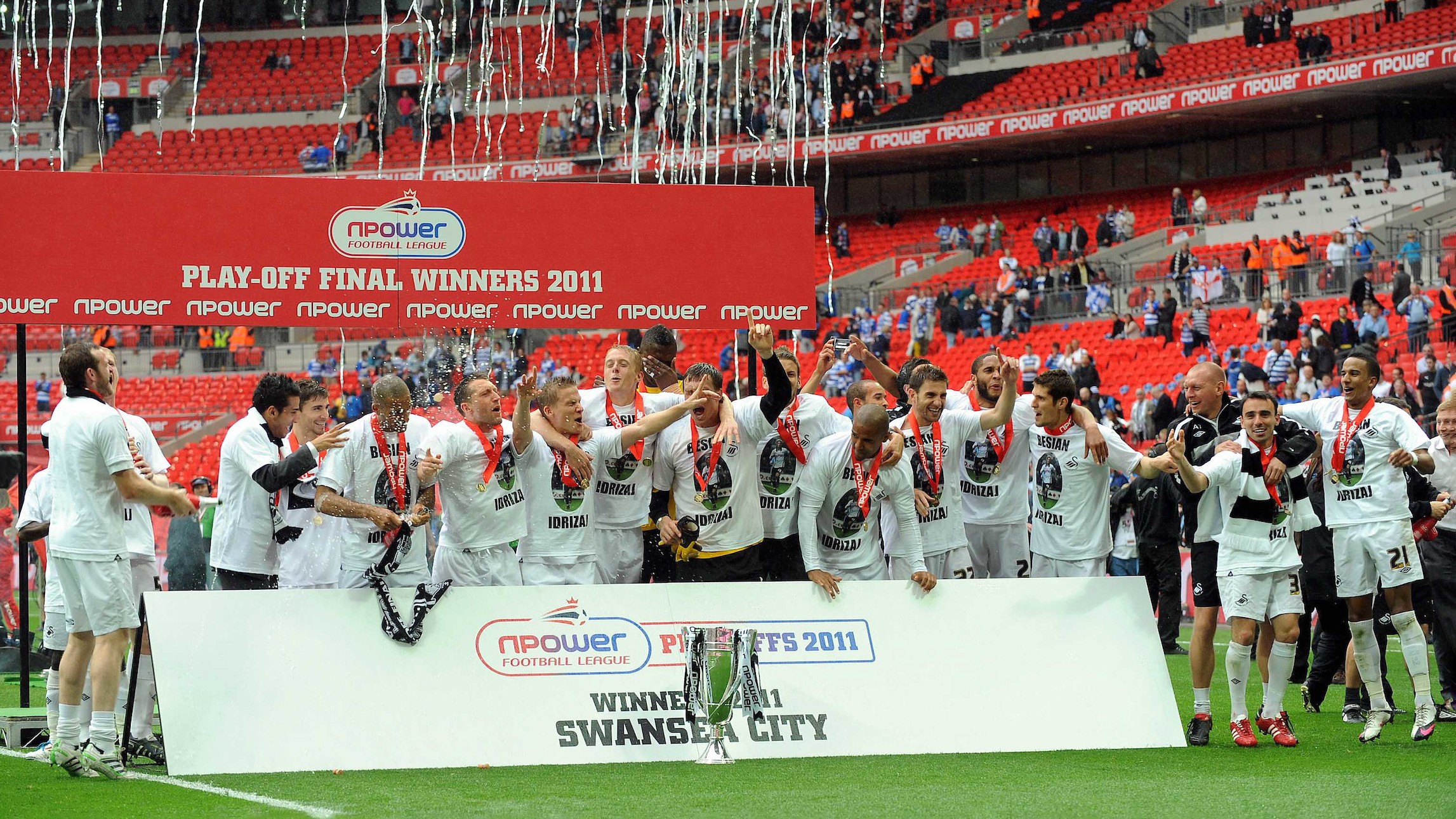 Swansea City lift the play-off trophy securing promotion to the Premier League