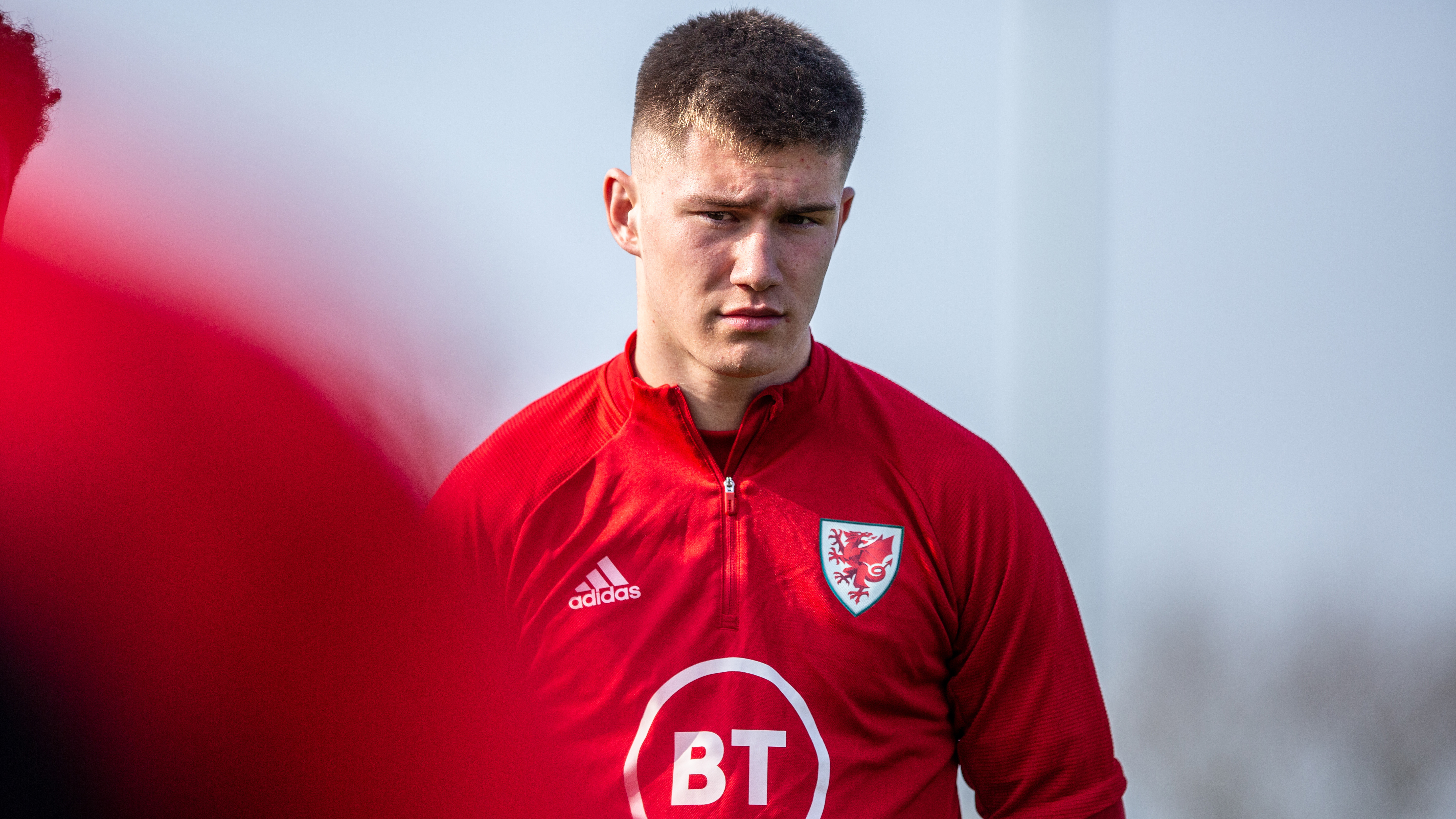 Close up of Cameron Congreve in red Wales training kit