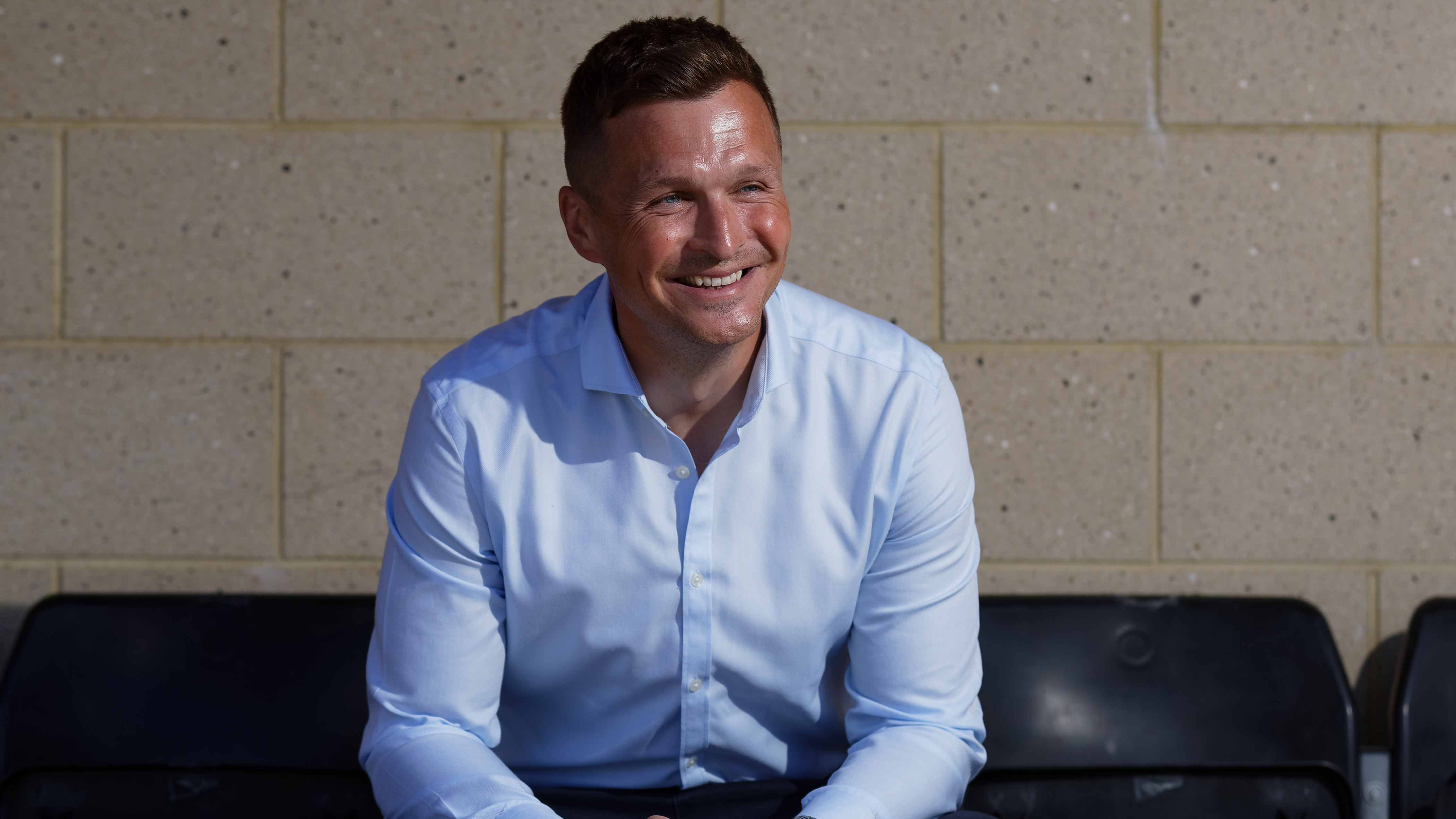 Andy Goldie sits in the stand seats at Fairwood Training Ground