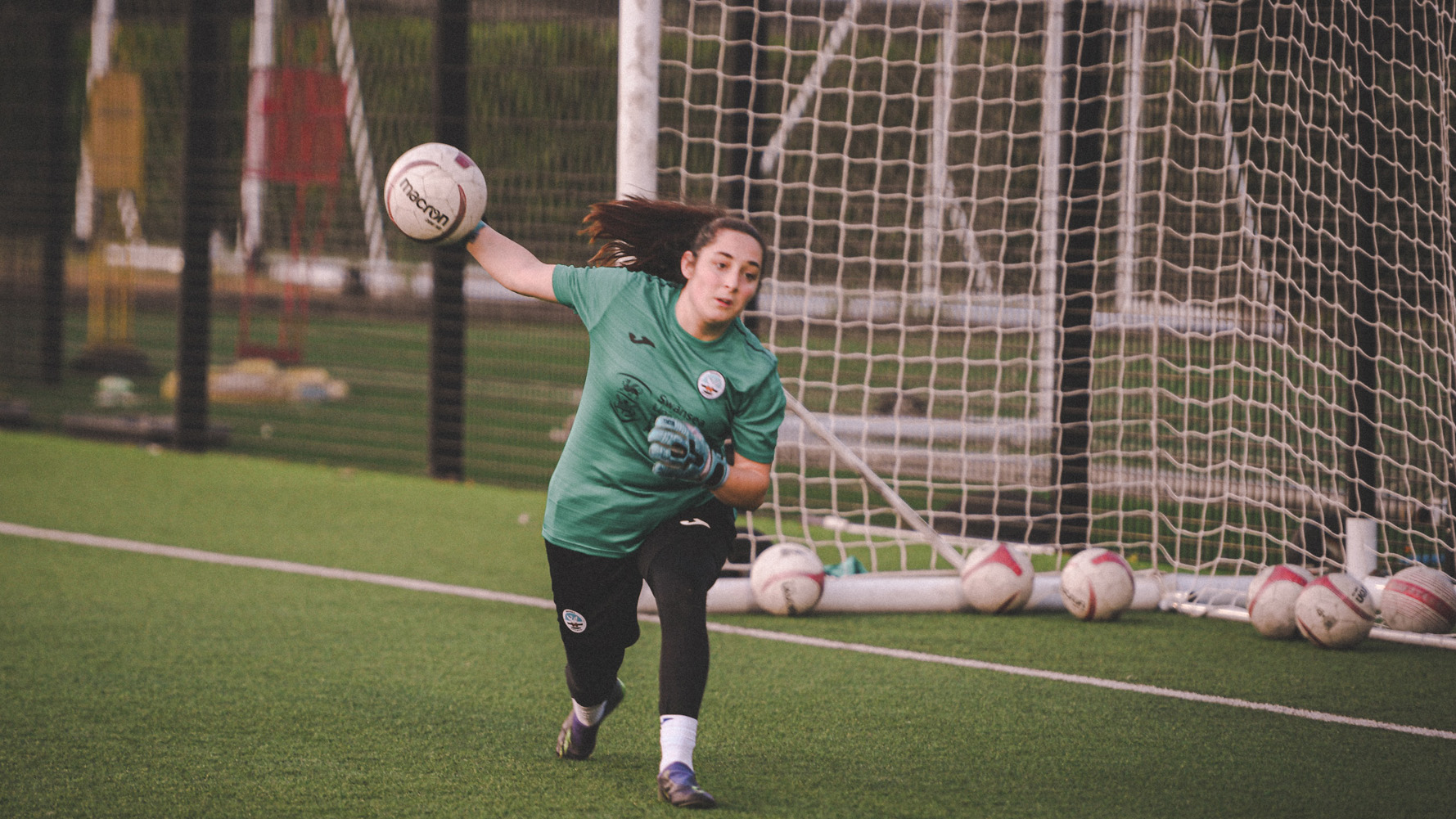 Chloe Herbert throws a ball to a team mate