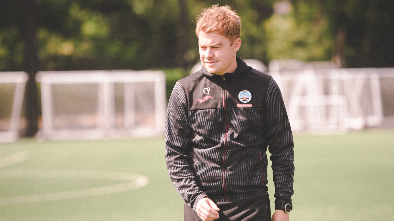 Ceri Phillips wearing his Swansea City tracksuit coaches the Ladies team