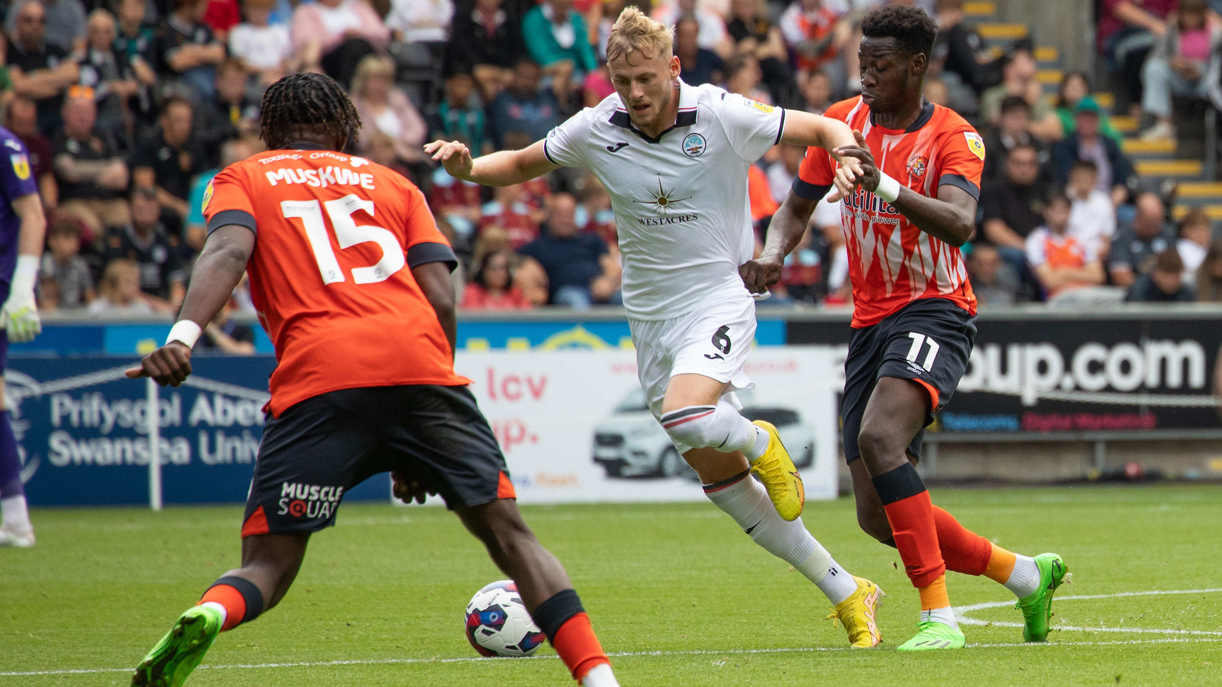 Harry Darling runs with the ball against Luton Town