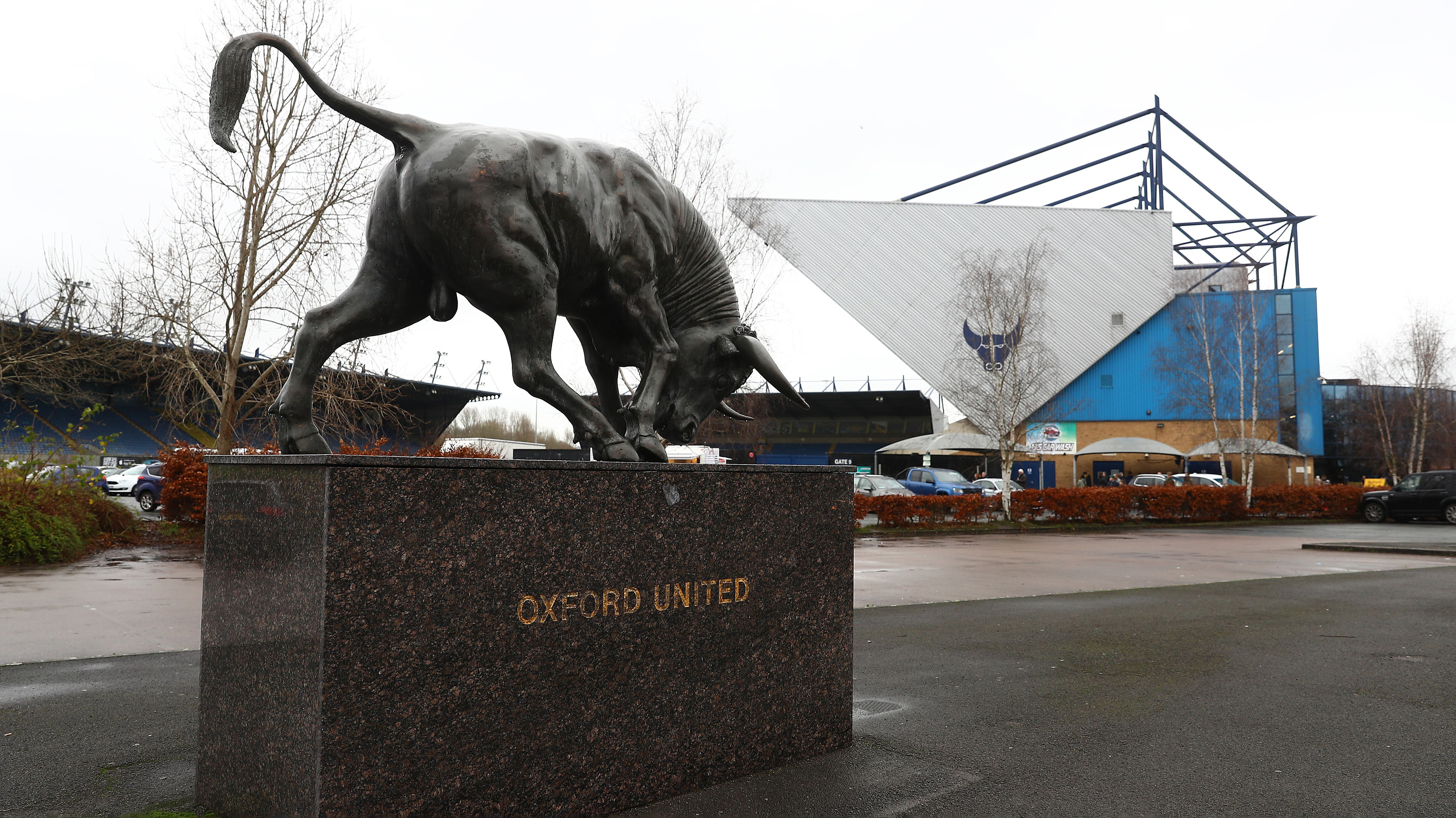 External shot of Oxford United's ground with the statue of the bull in the forefront