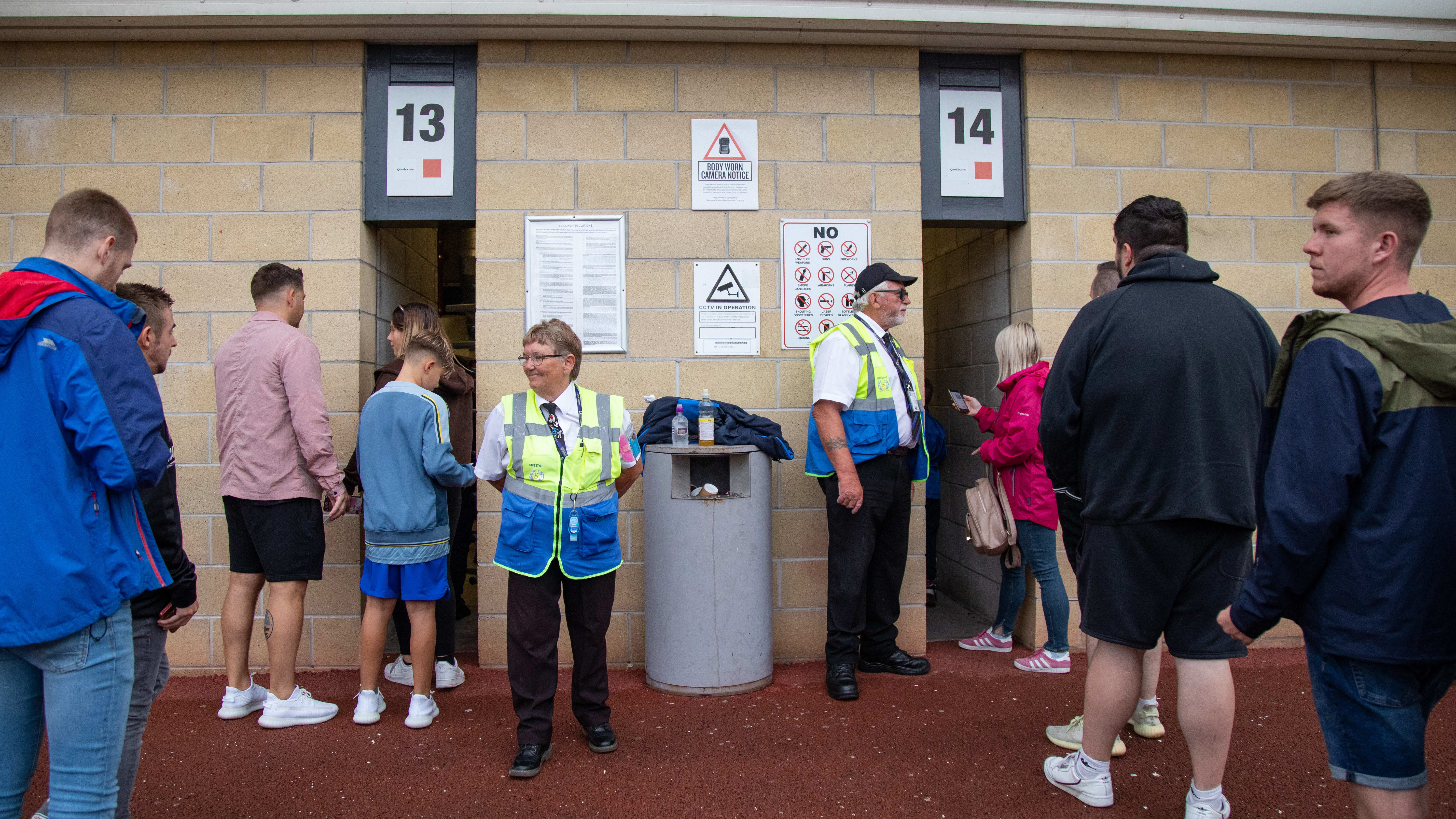 Supporters entering the Swansea.com Stadium via turnstiles