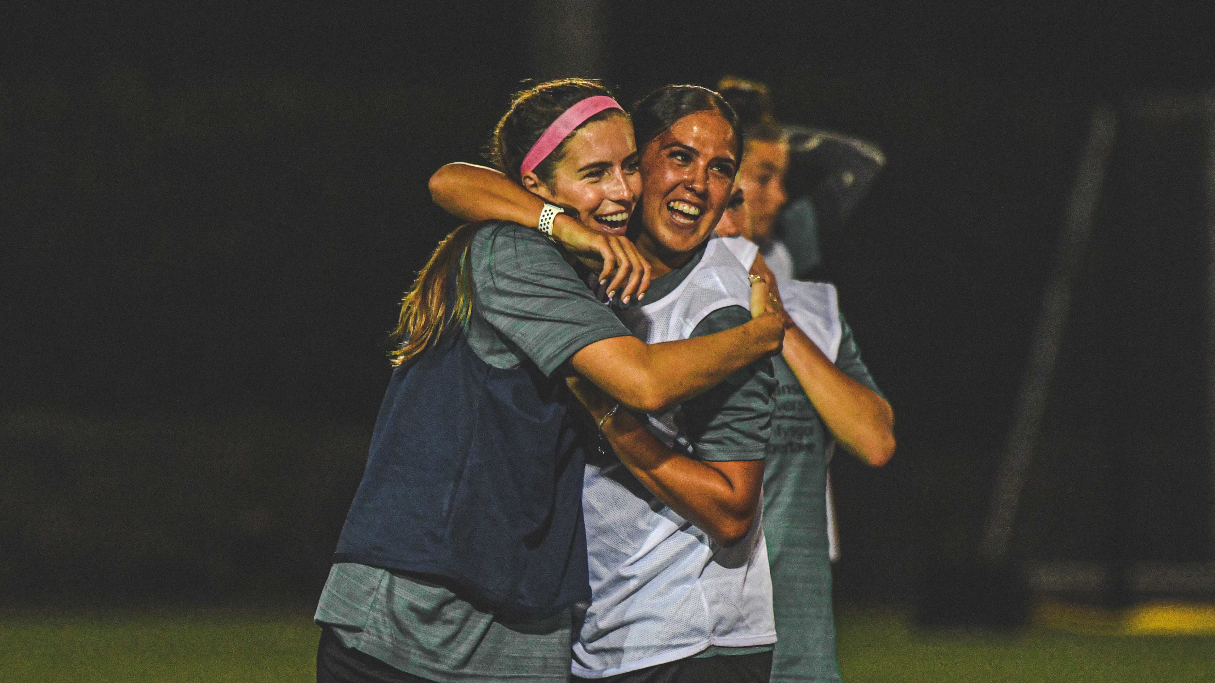 Katy Hosford and Jess Williams smiling during training