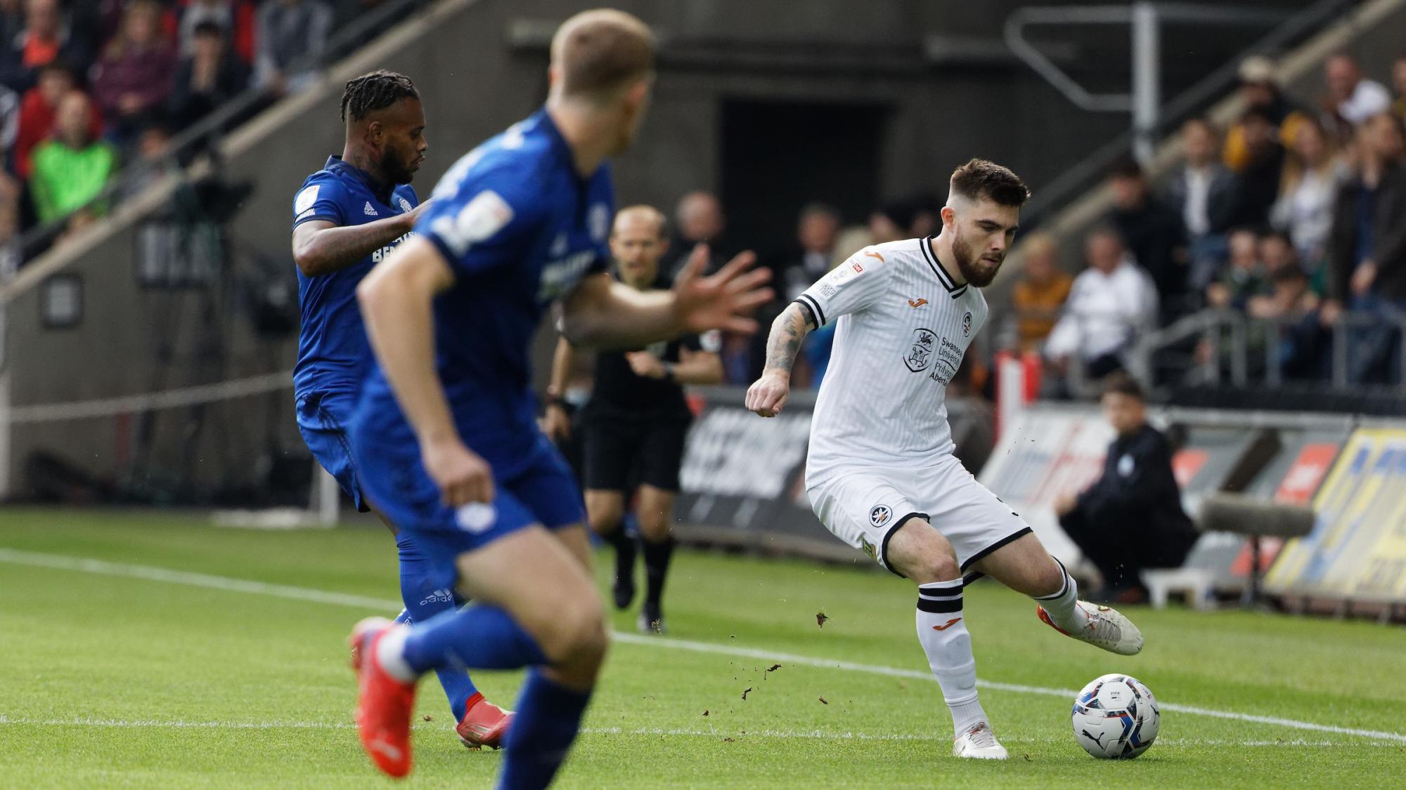 Ryan Manning makes a pass against Cardiff City