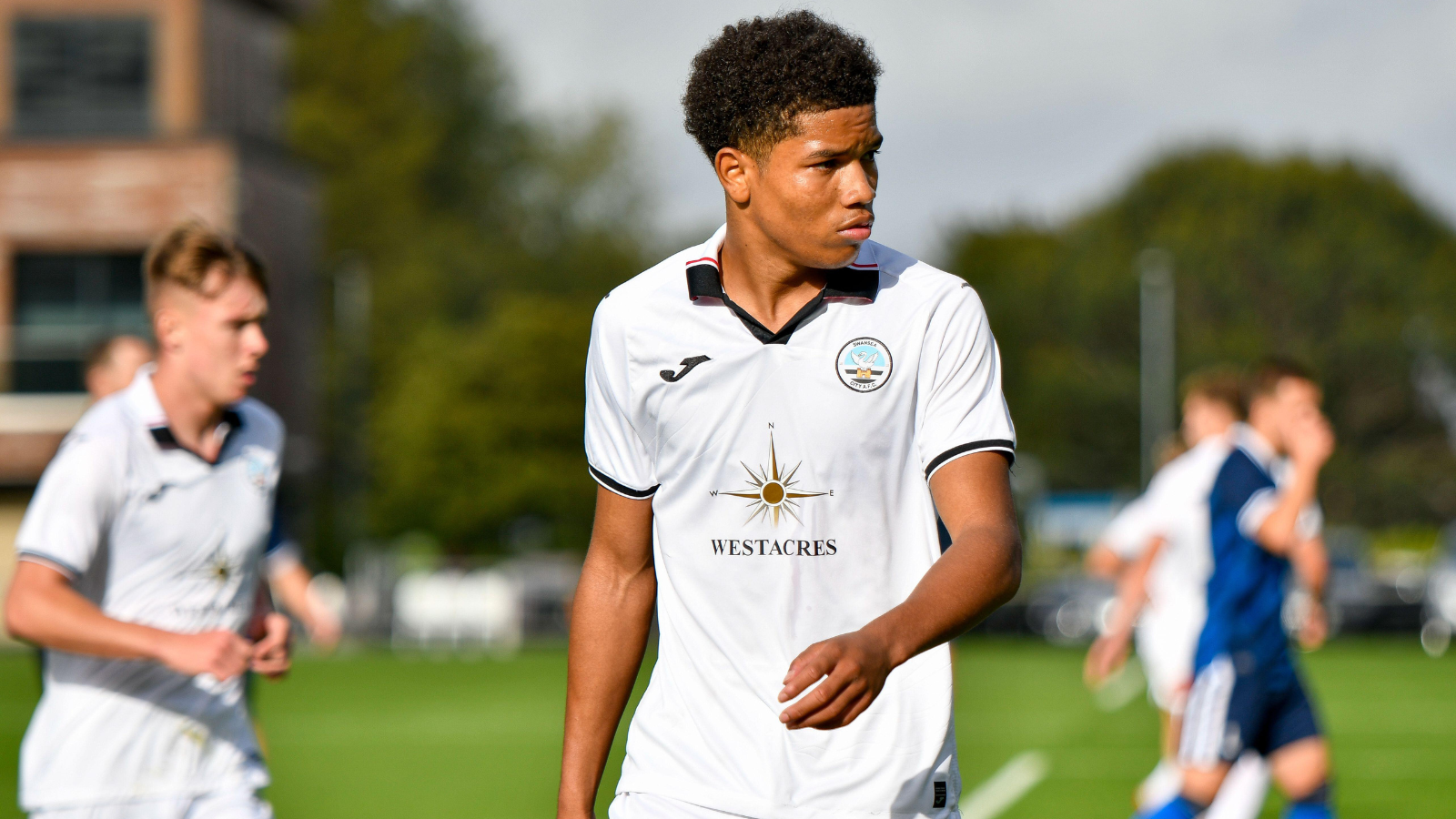 Swansea, Wales. 4 February 2023. Geoffroy Bony of Swansea City battles for  possession with Kyron Horsley-McKay of Millwall during the Professional  Development League game between Swansea City Under 18 and Millwall Under