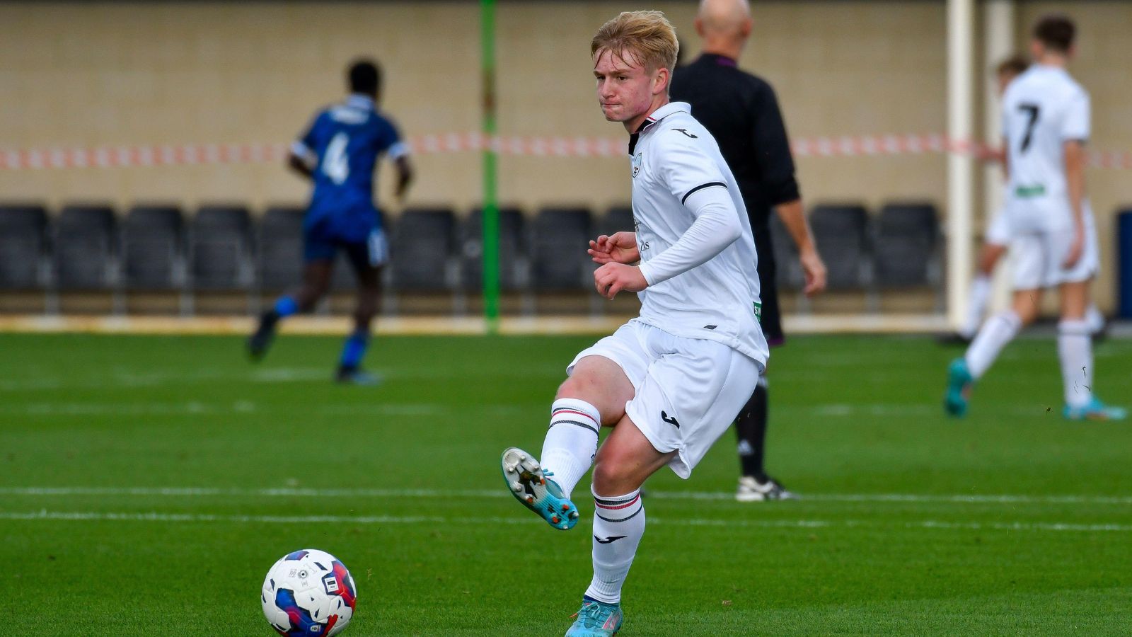 Swansea, Wales. 4 February 2023. Richard Faakye of Swansea City holds off  the challenge from Jack Howland of Millwall during the Professional  Development League game between Swansea City Under 18 and Millwall