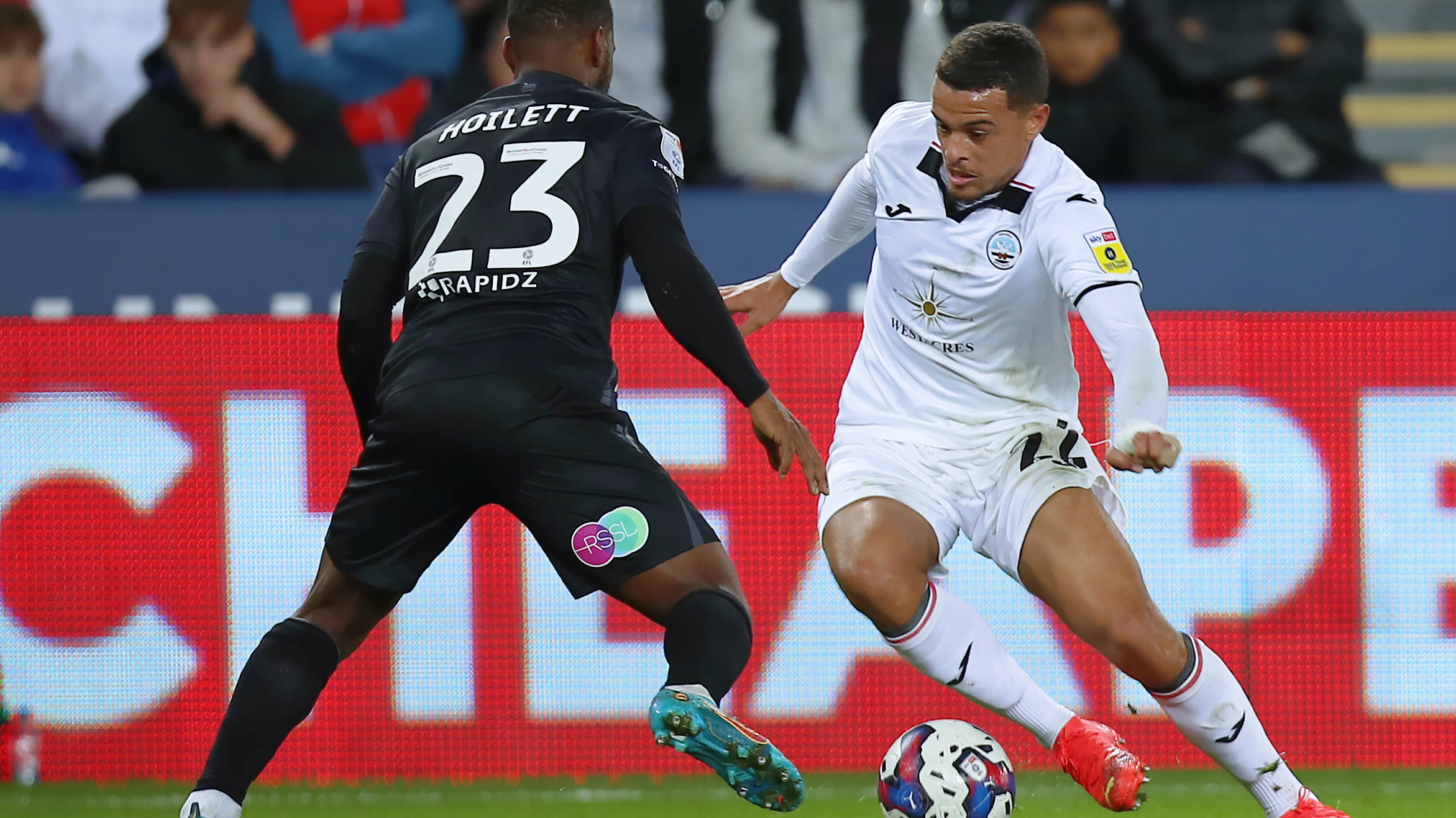 Joel Latibeaudiere takes on a player against Reading