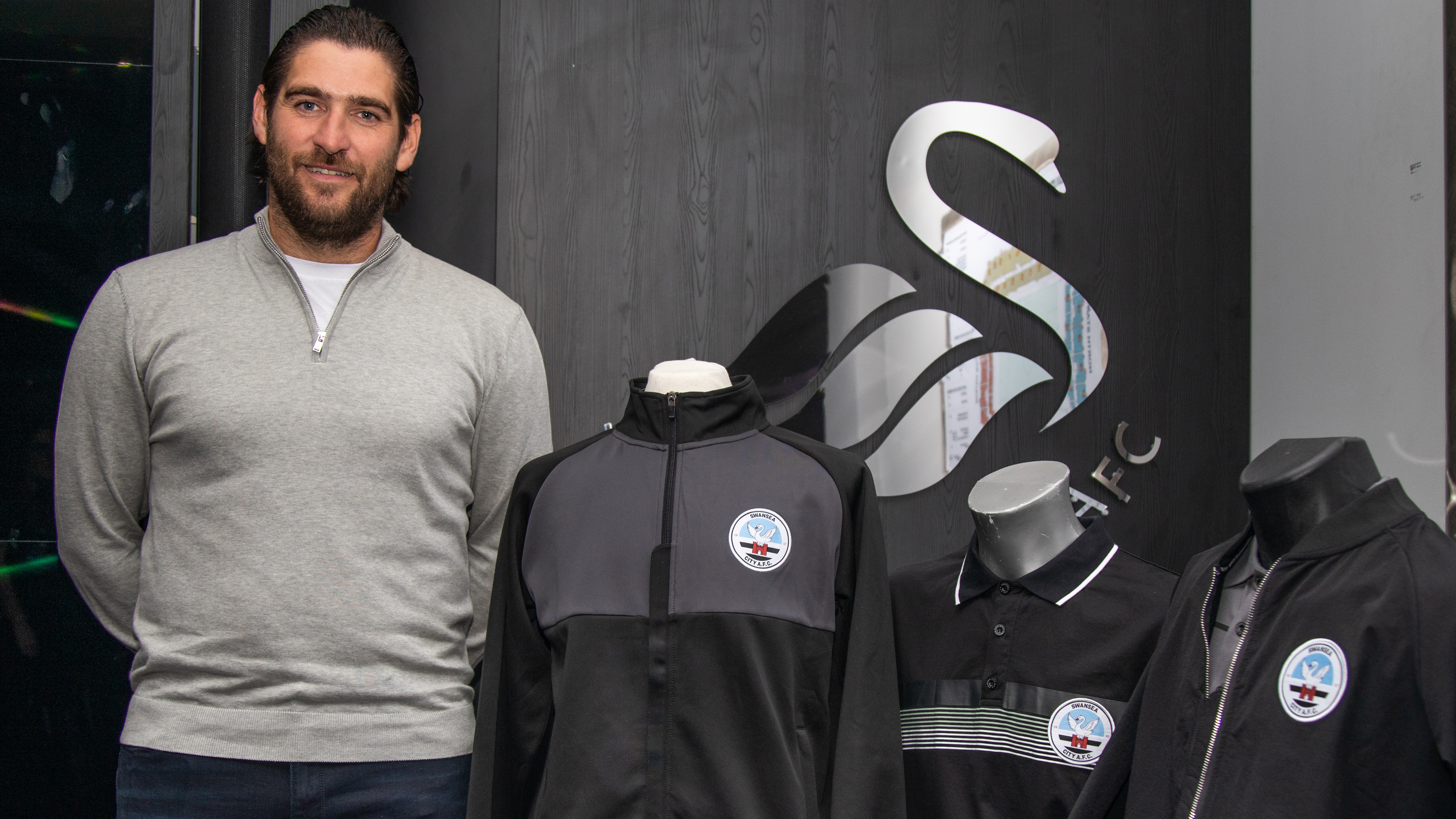 Danny Graham poses next to new Swansea City Fugati products