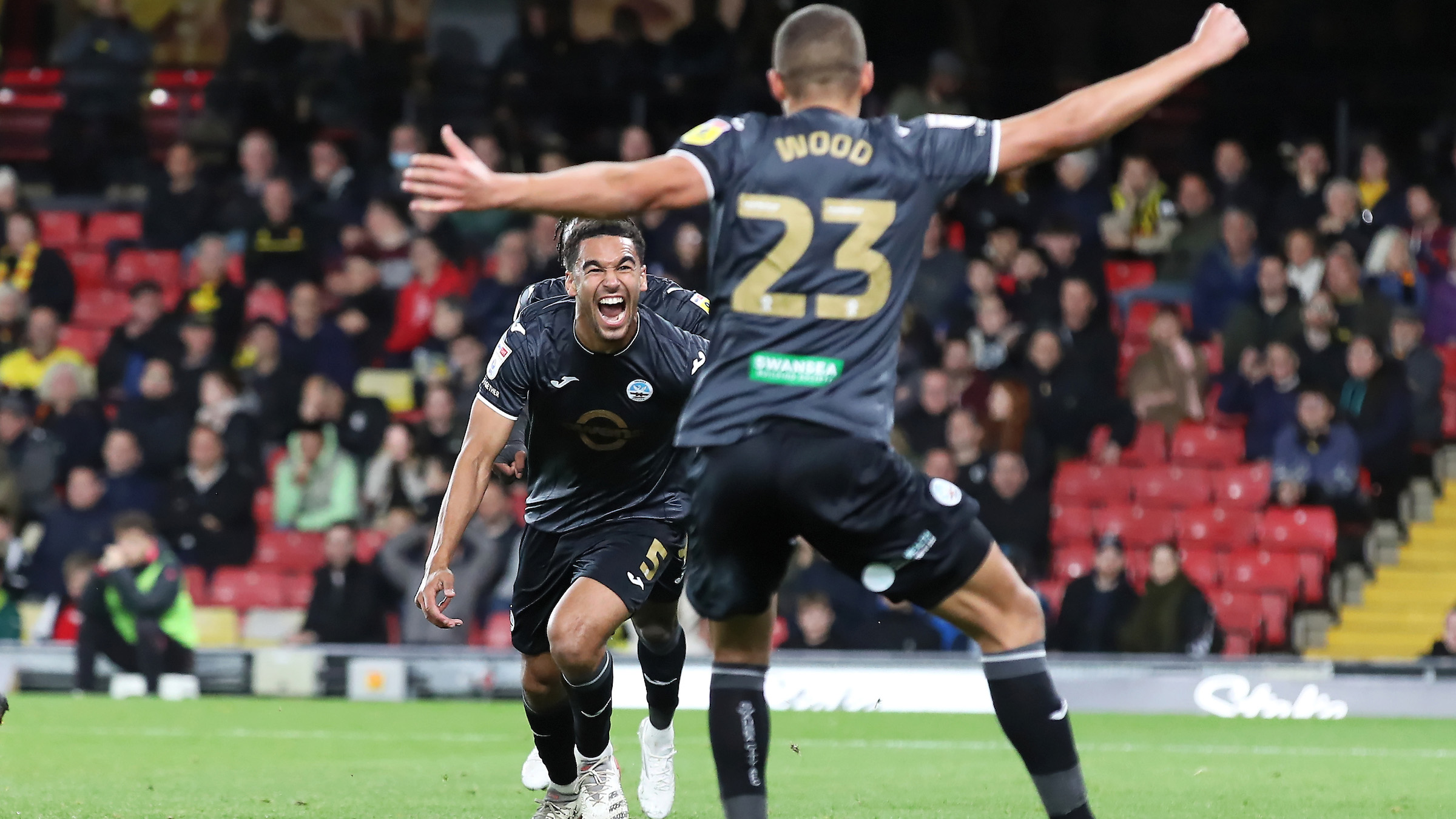 Ben Cabango celebrates with Nathan Wood