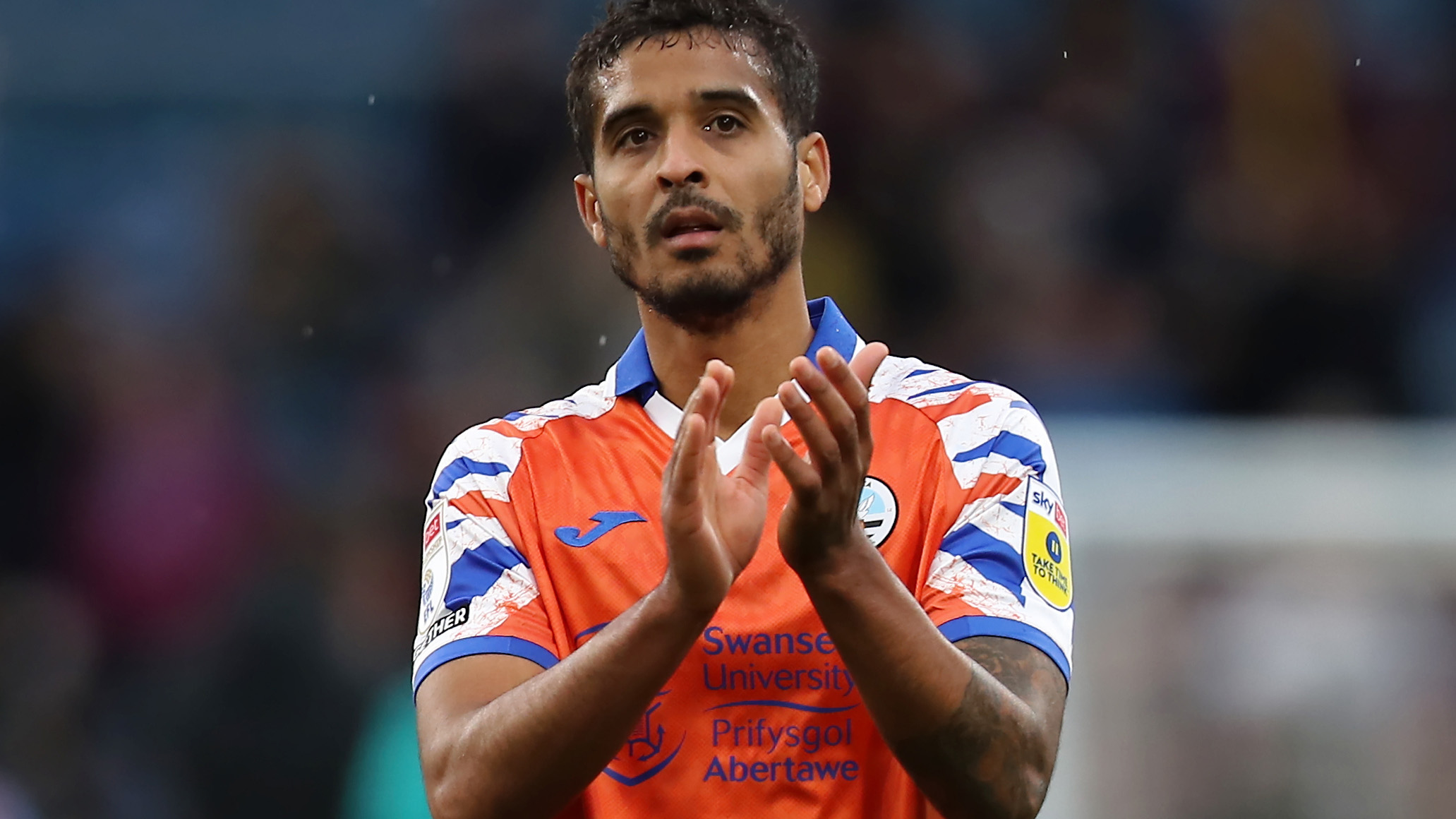 Kyle Naughton claps fans