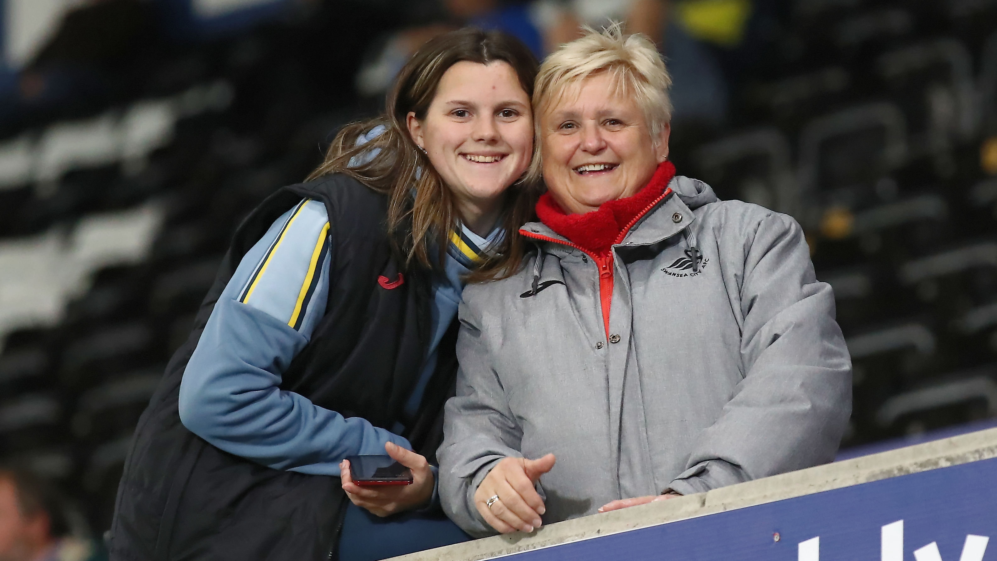 Two women supporting Swansea City against Reading