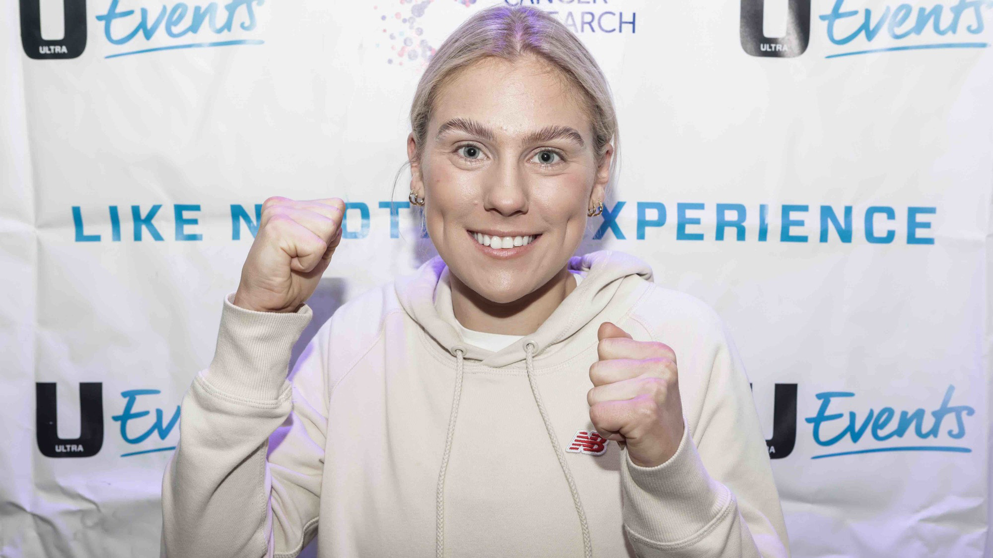 Ellie faces towards the camera in a boxing pose