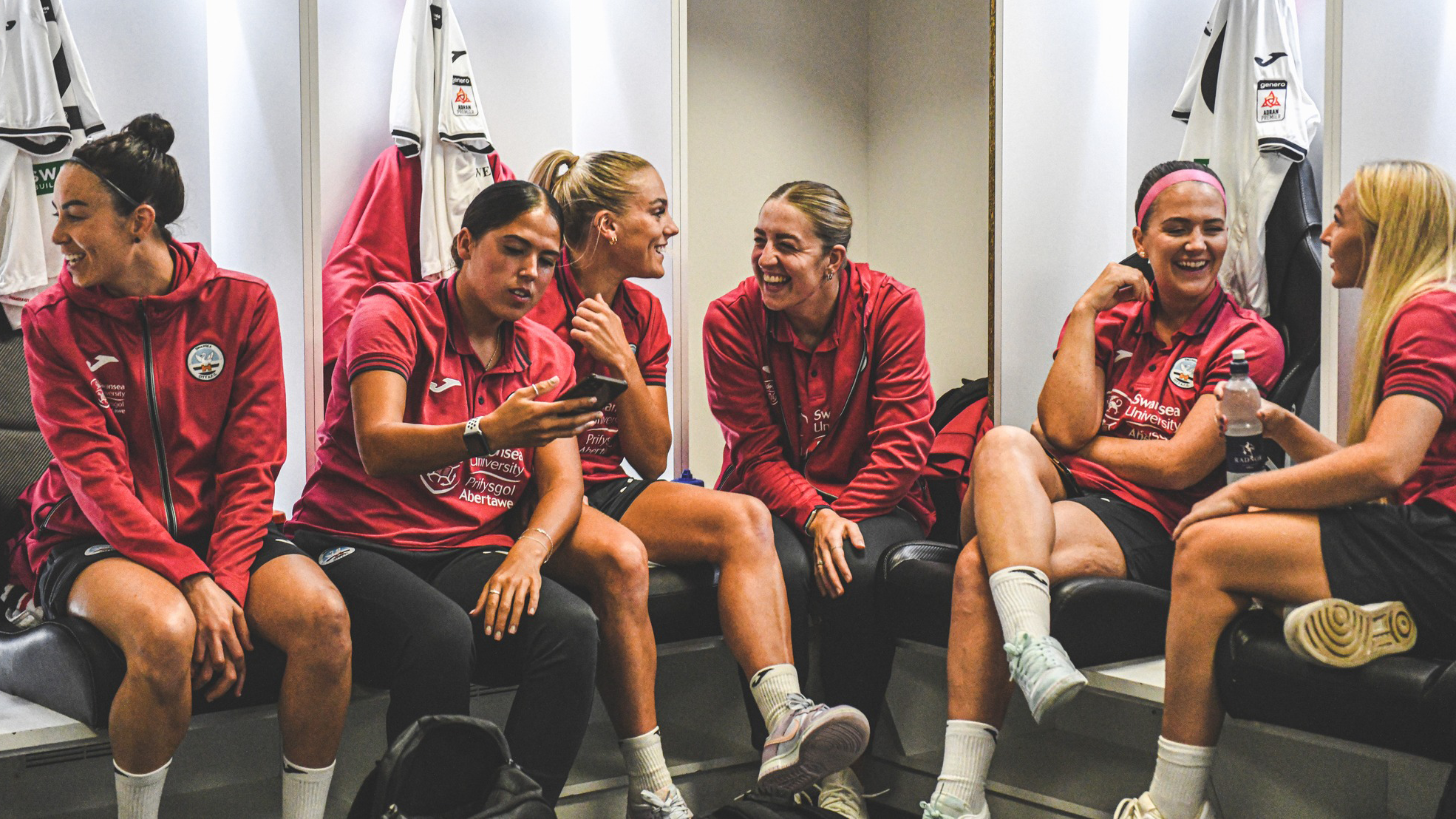 Jess Williams, Ellie Lake, Emma Beynon, Lucy Finch and Kelly Adams laughing in the Swansea.com changing rooms