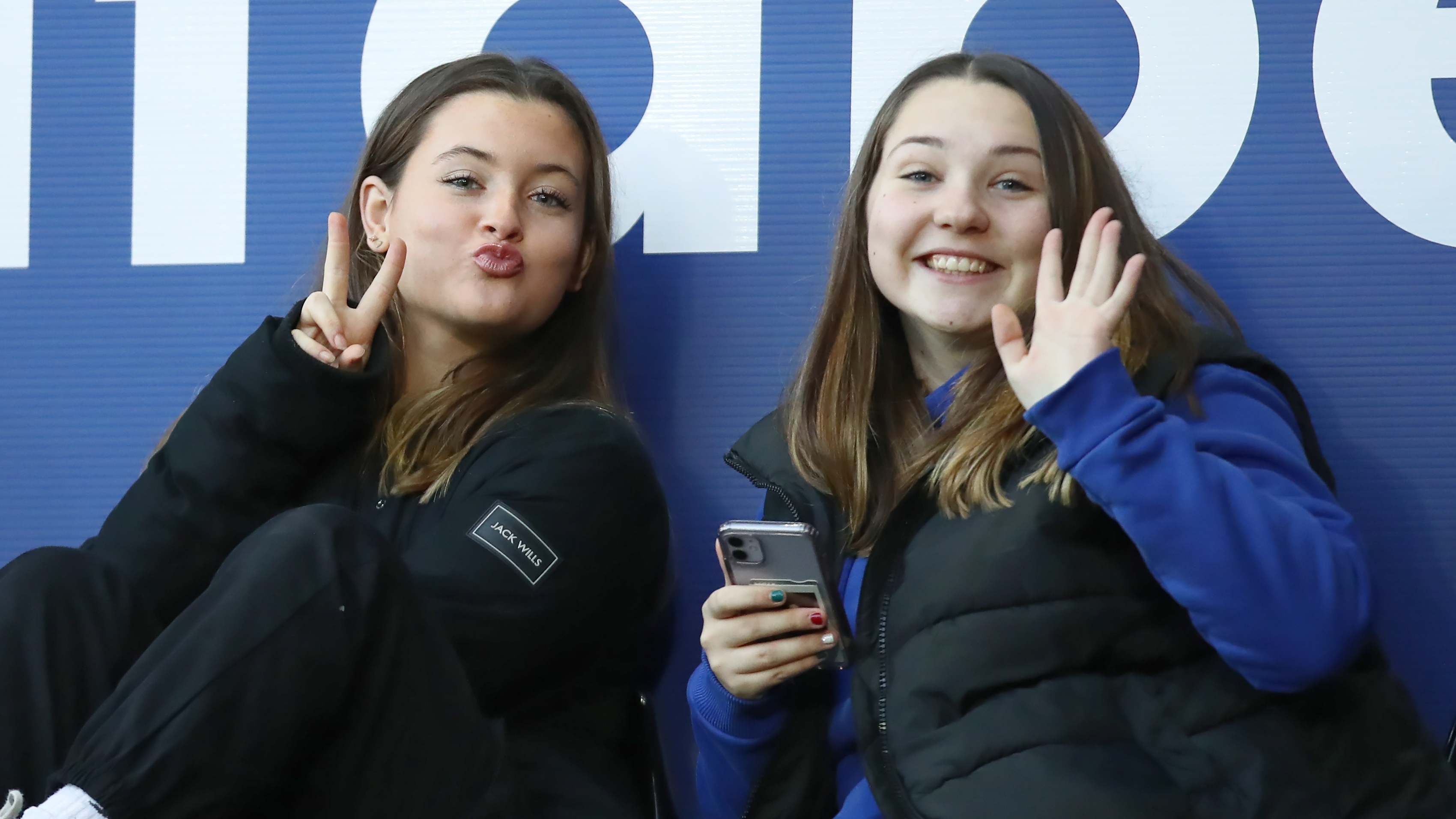 Two fans pose for the camera at Norwich City home match