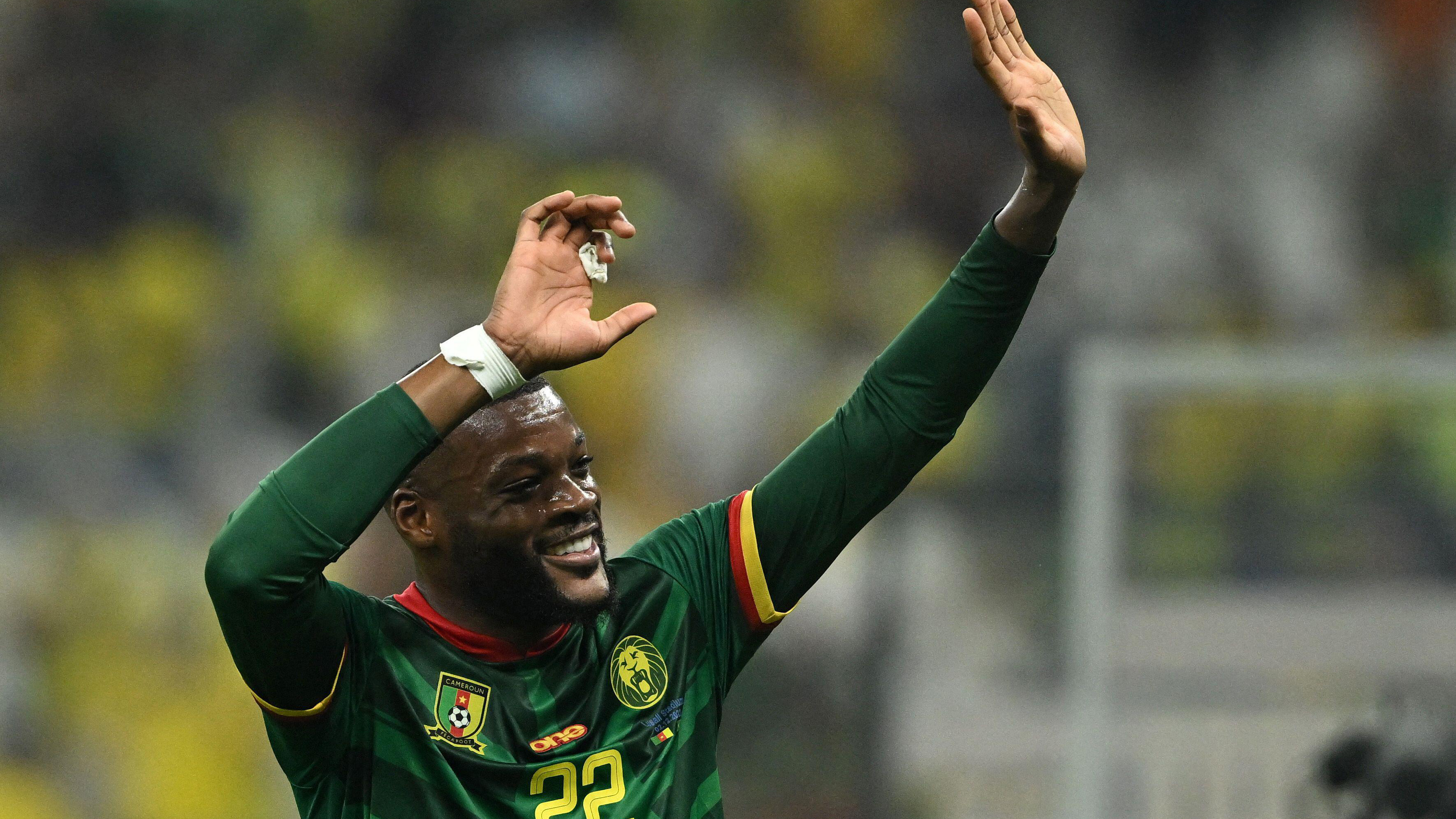 Olivier Ntcham waves to people in the crowd after Cameroon beat Brazil