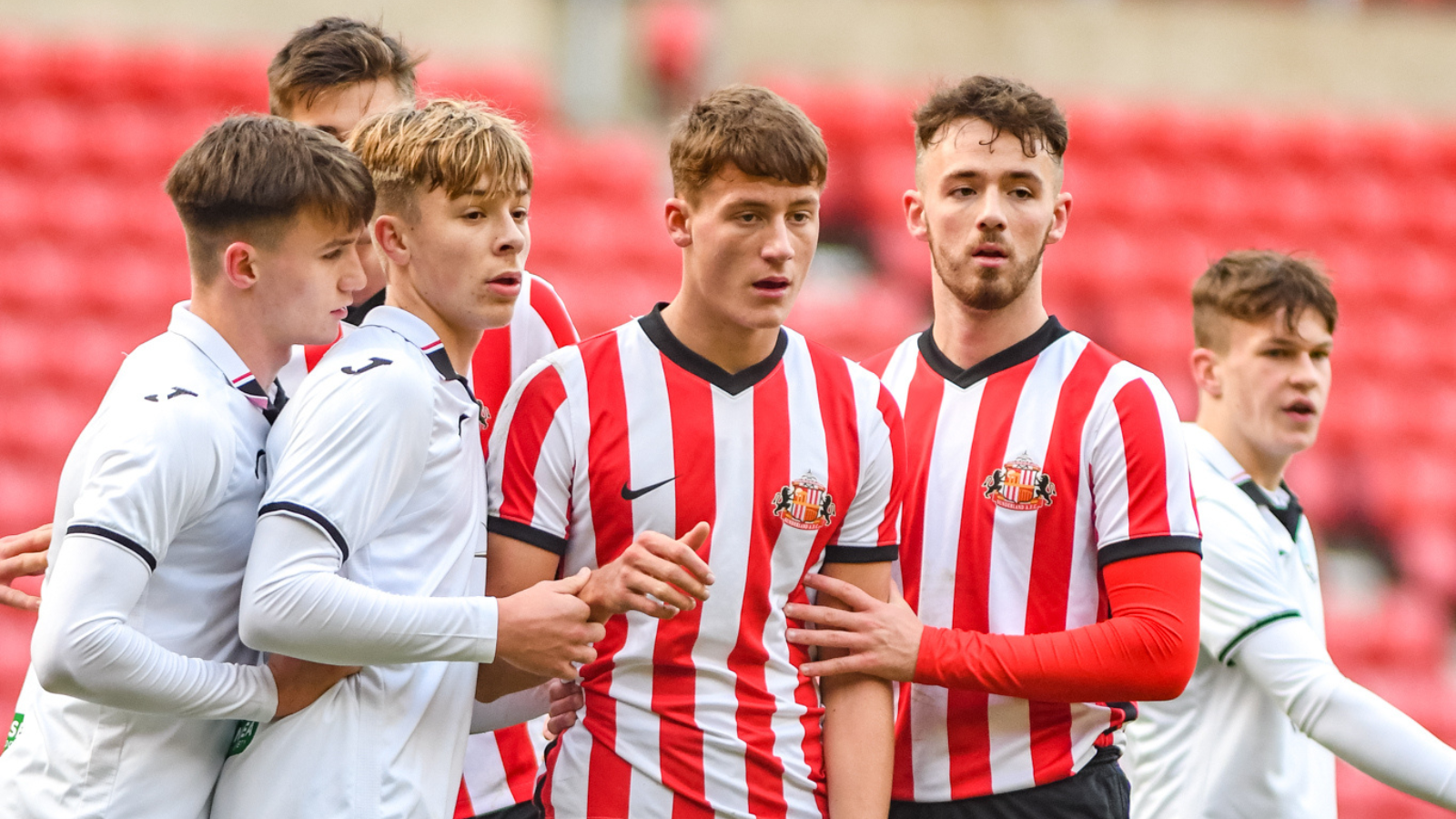 Swansea, Wales. 4 February 2023. Iwan Morgan of Swansea City high fives  Aimar Govea of Swansea City during the Professional Development League game  between Swansea City Under 18 and Millwall Under 18