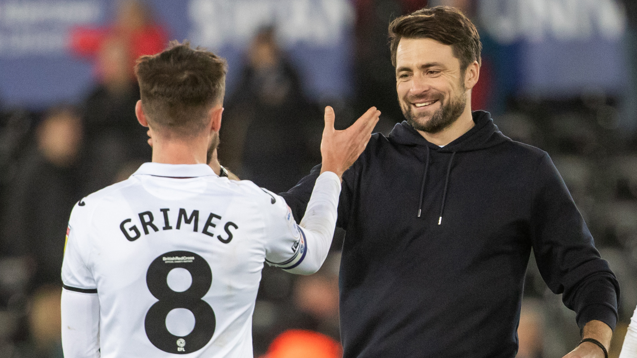 Russell Martin congratulates  Matt Grimes after a match