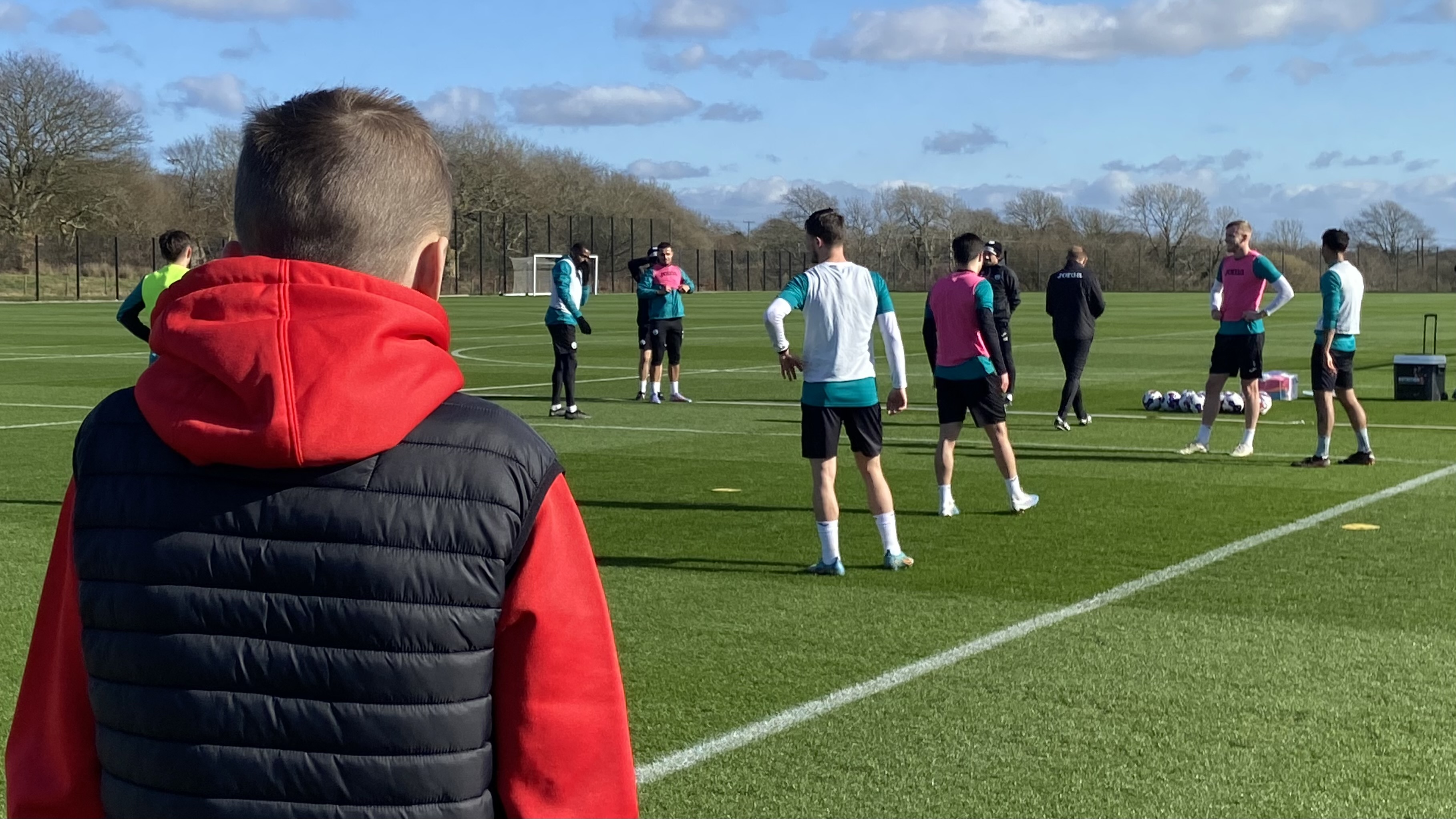 Swans fan Alfie watches training