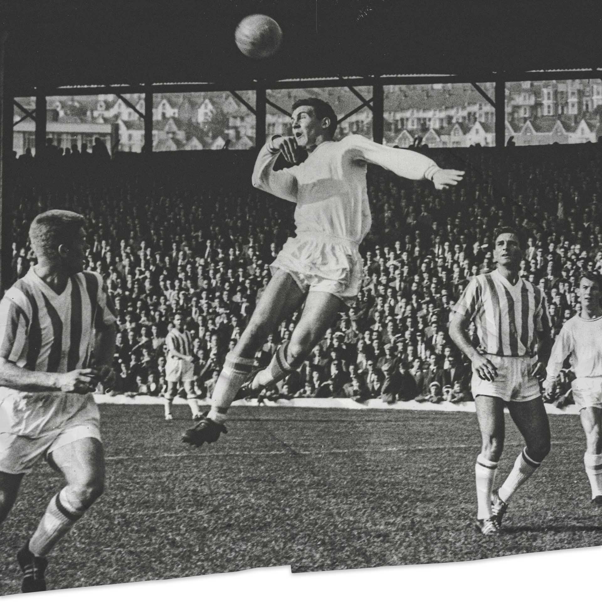 Herbie Williams Heads the ball toward goal