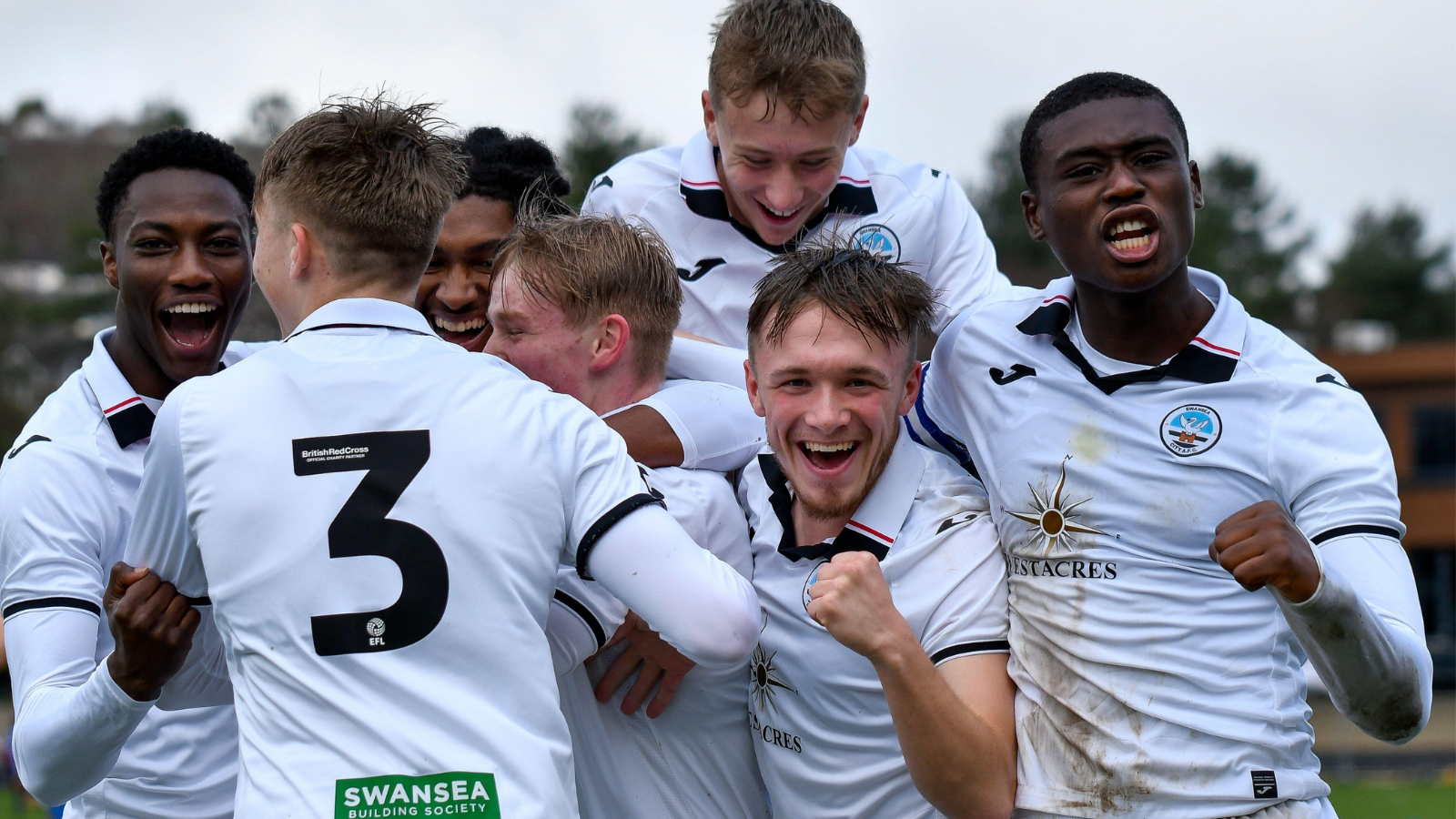 Swansea, Wales. 4 February 2023. Iwan Morgan of Swansea City high fives  Aimar Govea of Swansea City during the Professional Development League game  between Swansea City Under 18 and Millwall Under 18