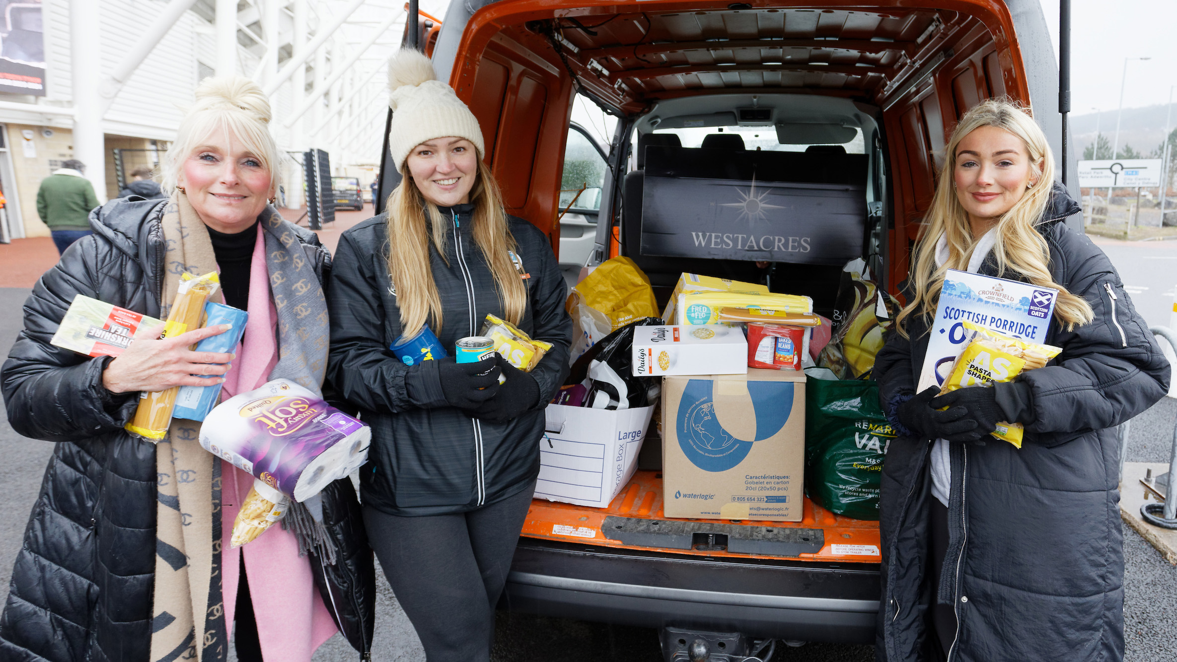 People dropping off items for the food bank