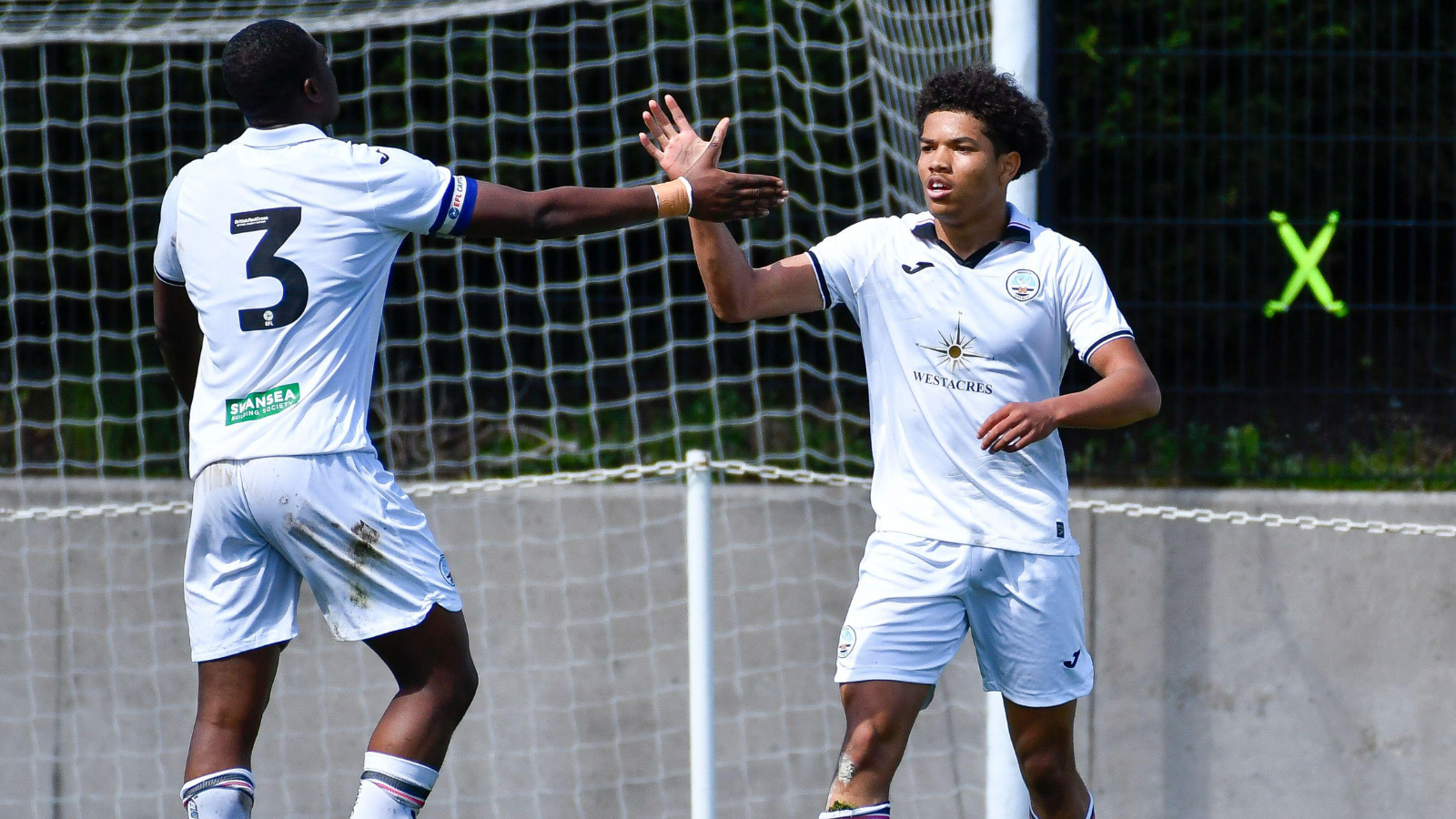 Kyrell Wilson celebrates with Richard Faakye.