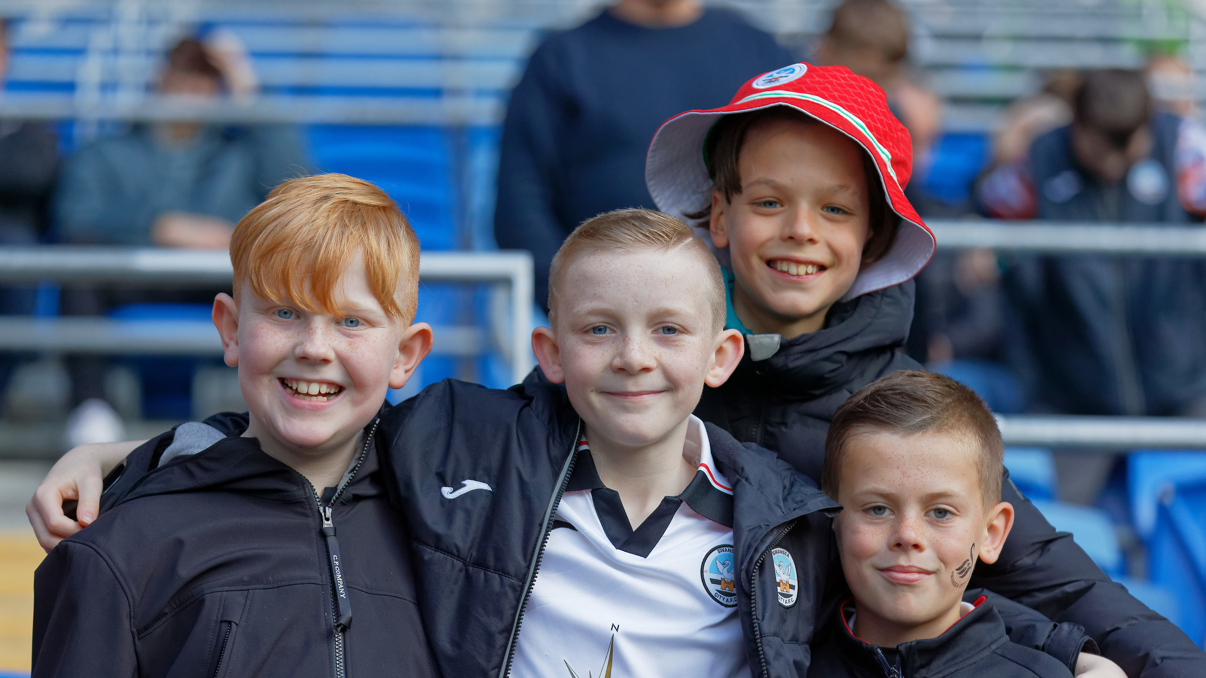 Four young supporters at the south Wales derby