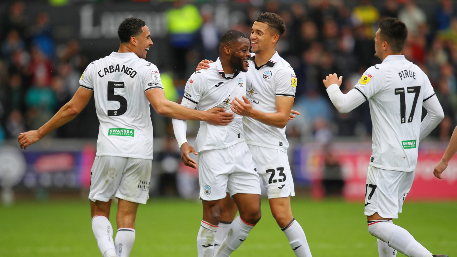 Olivier Ntcham celebrates with team-mates.