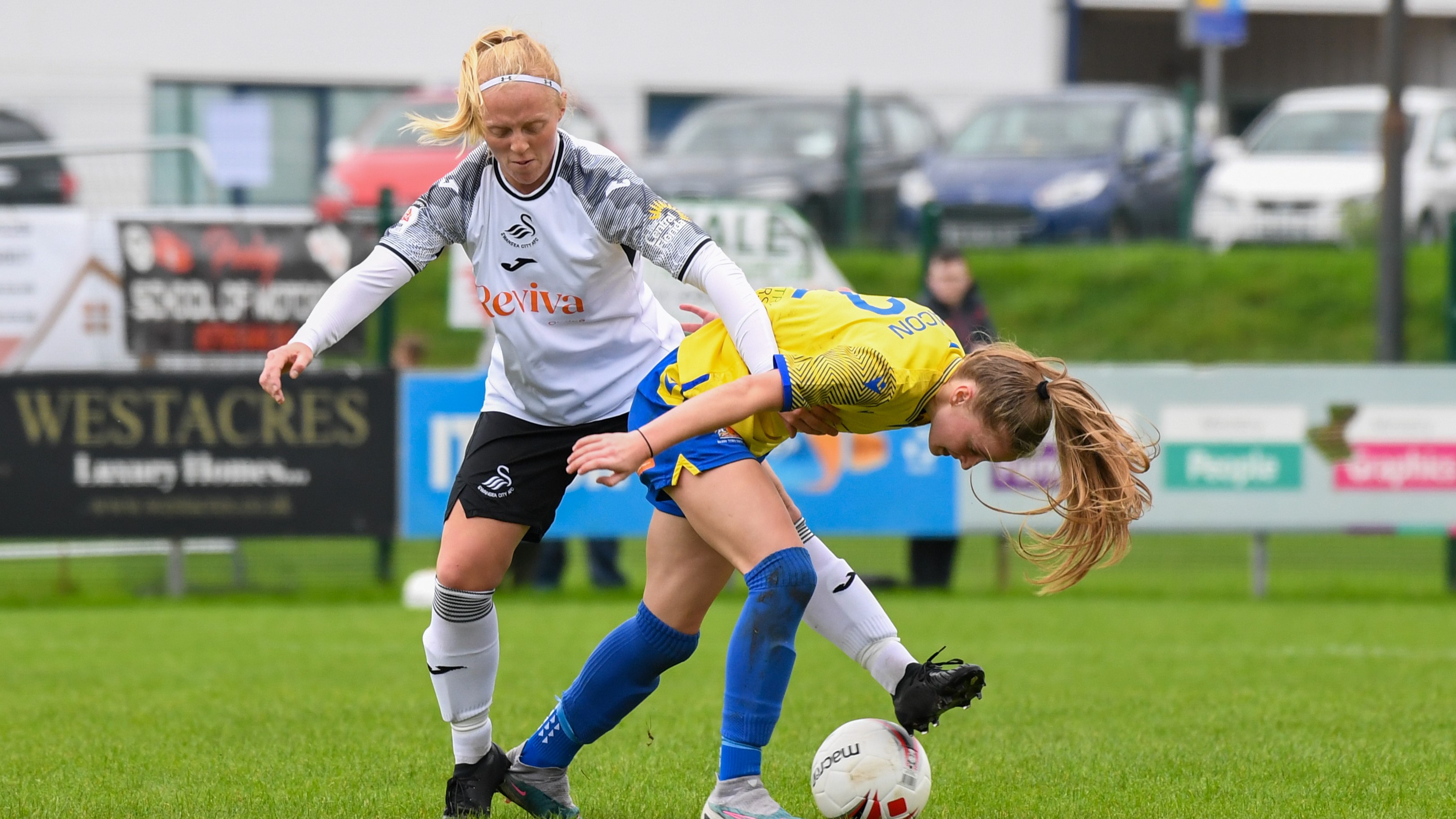 Sophie Brisland-Hancocks wins a tackle against Barry Town