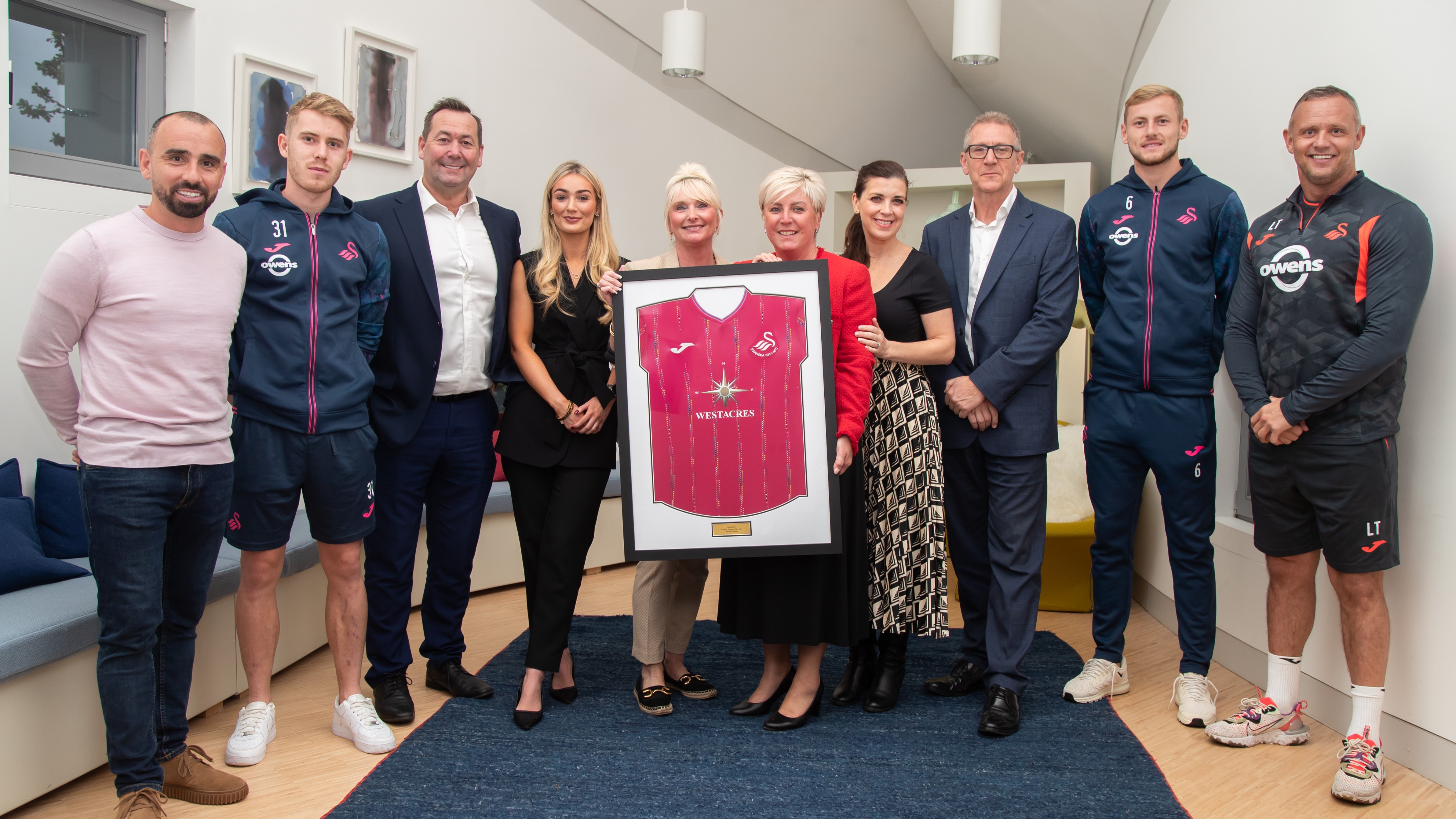 Westacres, SBS and the Swans hand over third shirt to Maggie's