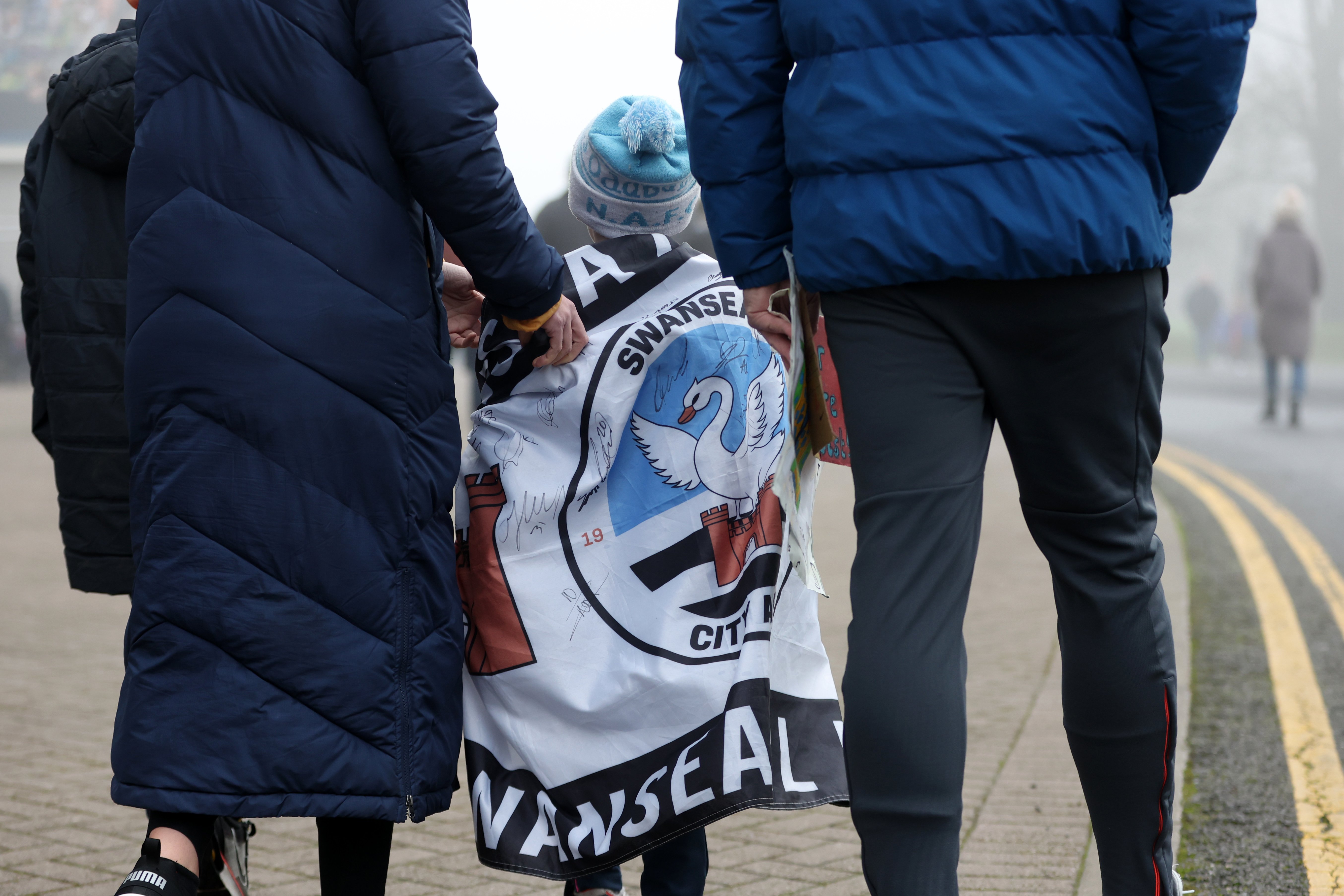 Swansea City players arrive at the stadium