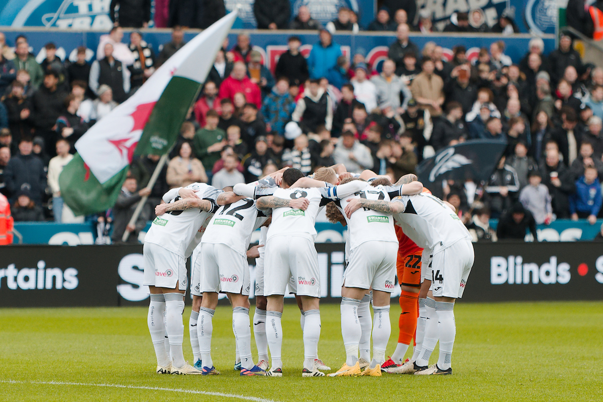 Swansea City players in a pre-match huddle