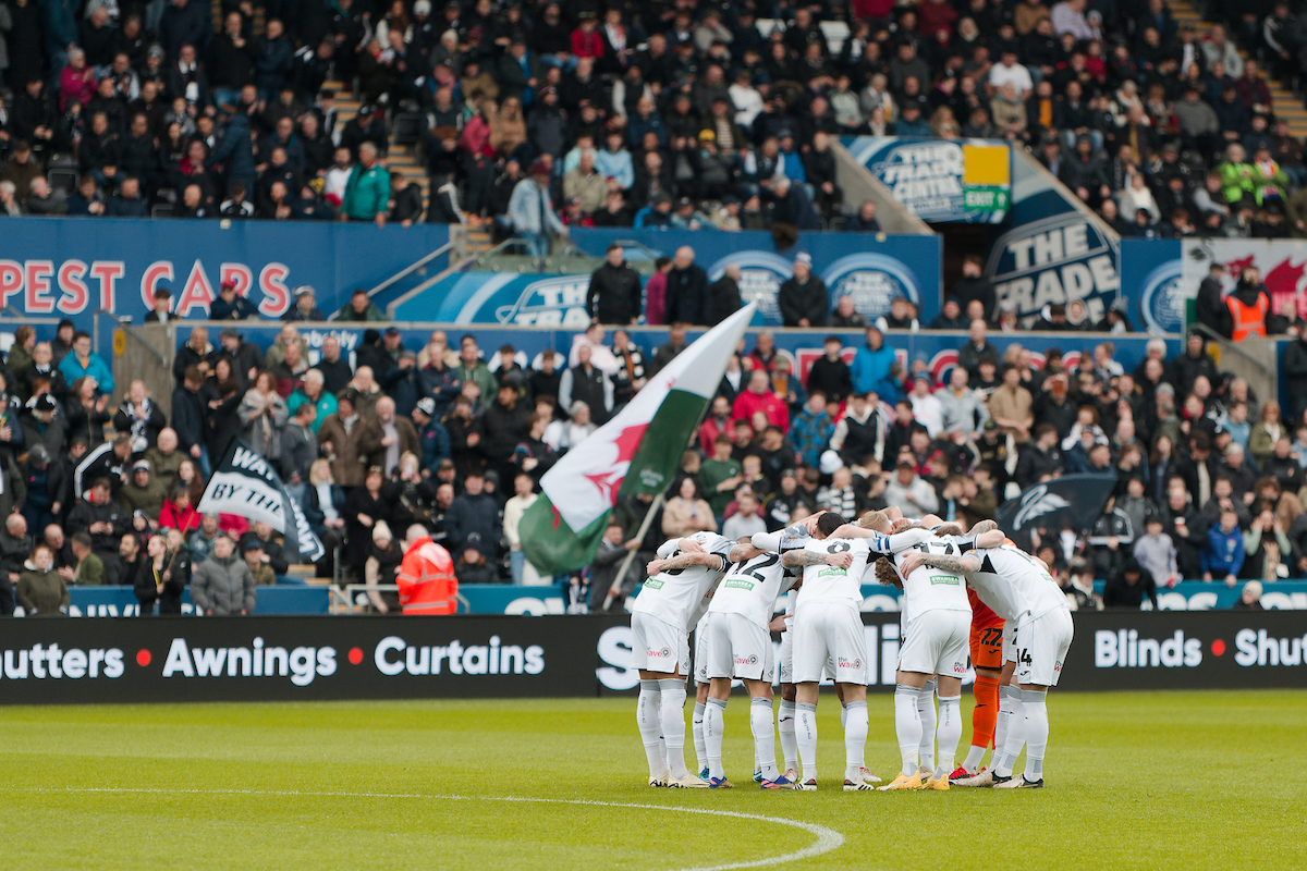 Swansea City player huddle before the home game against Cardiff City in March 2024