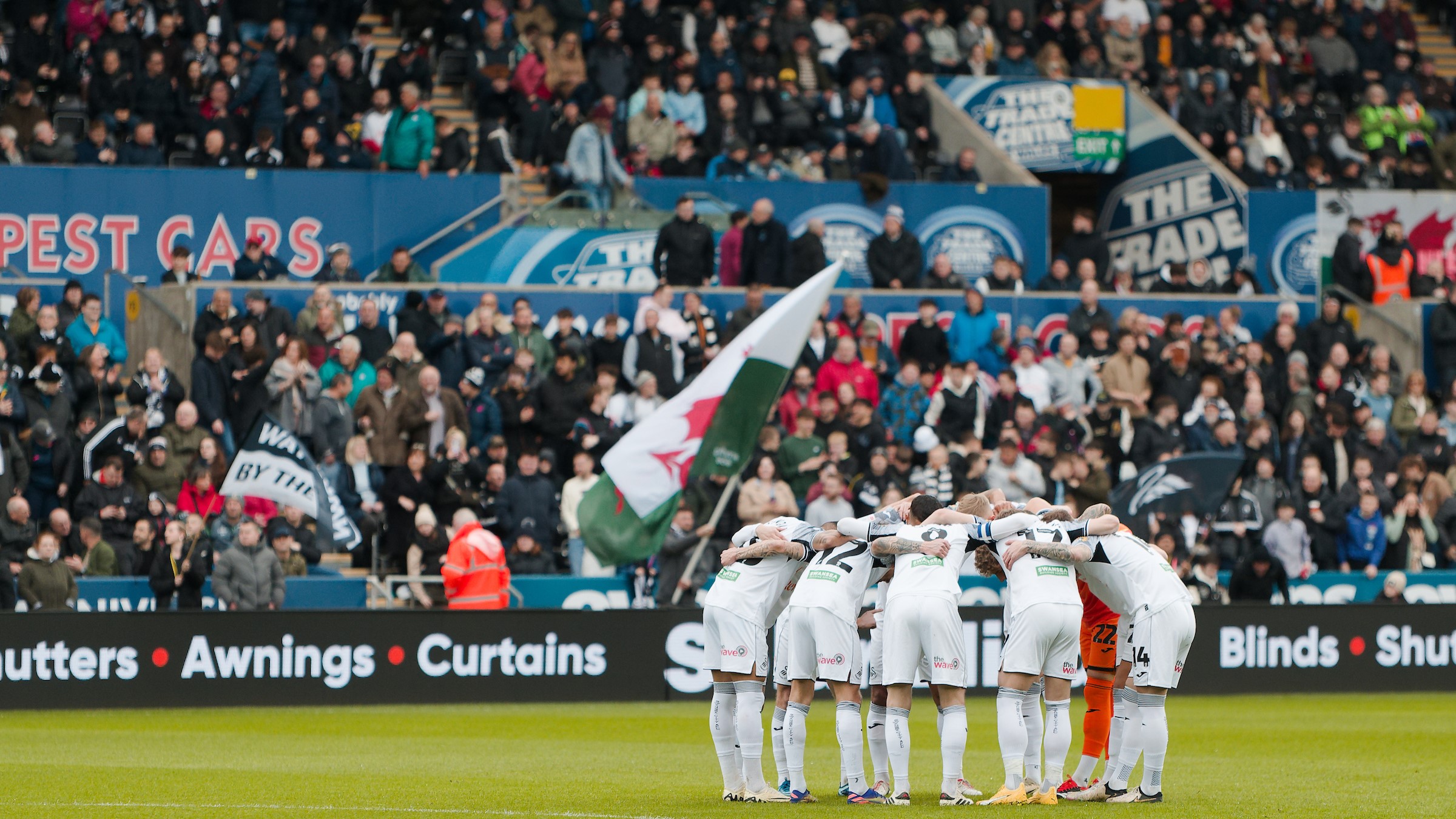 Swansea City huddle