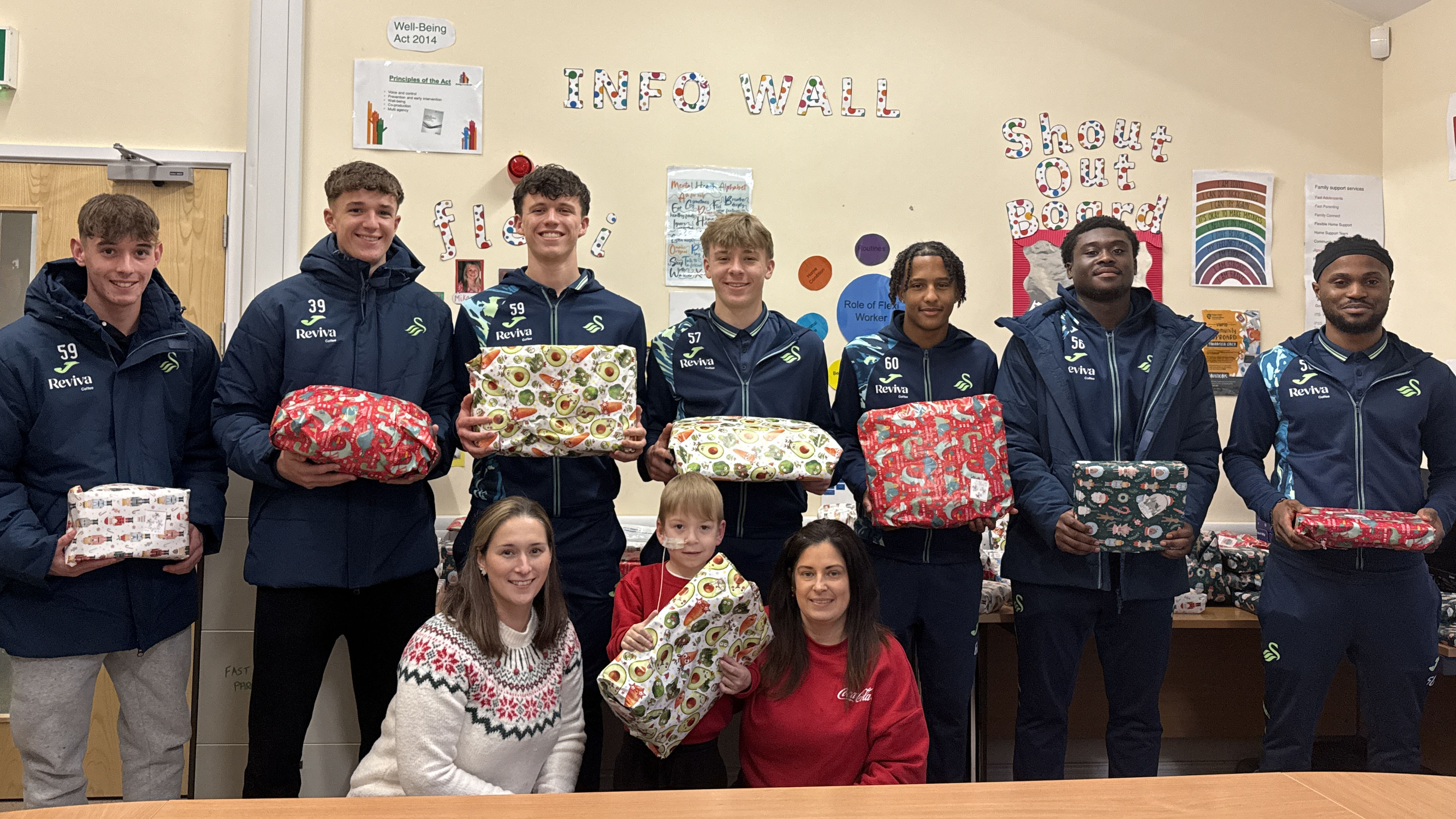 Swansea City Under-21s players have made a considerable donation of gifts to social services, which will be distributed to families and children in the local area.