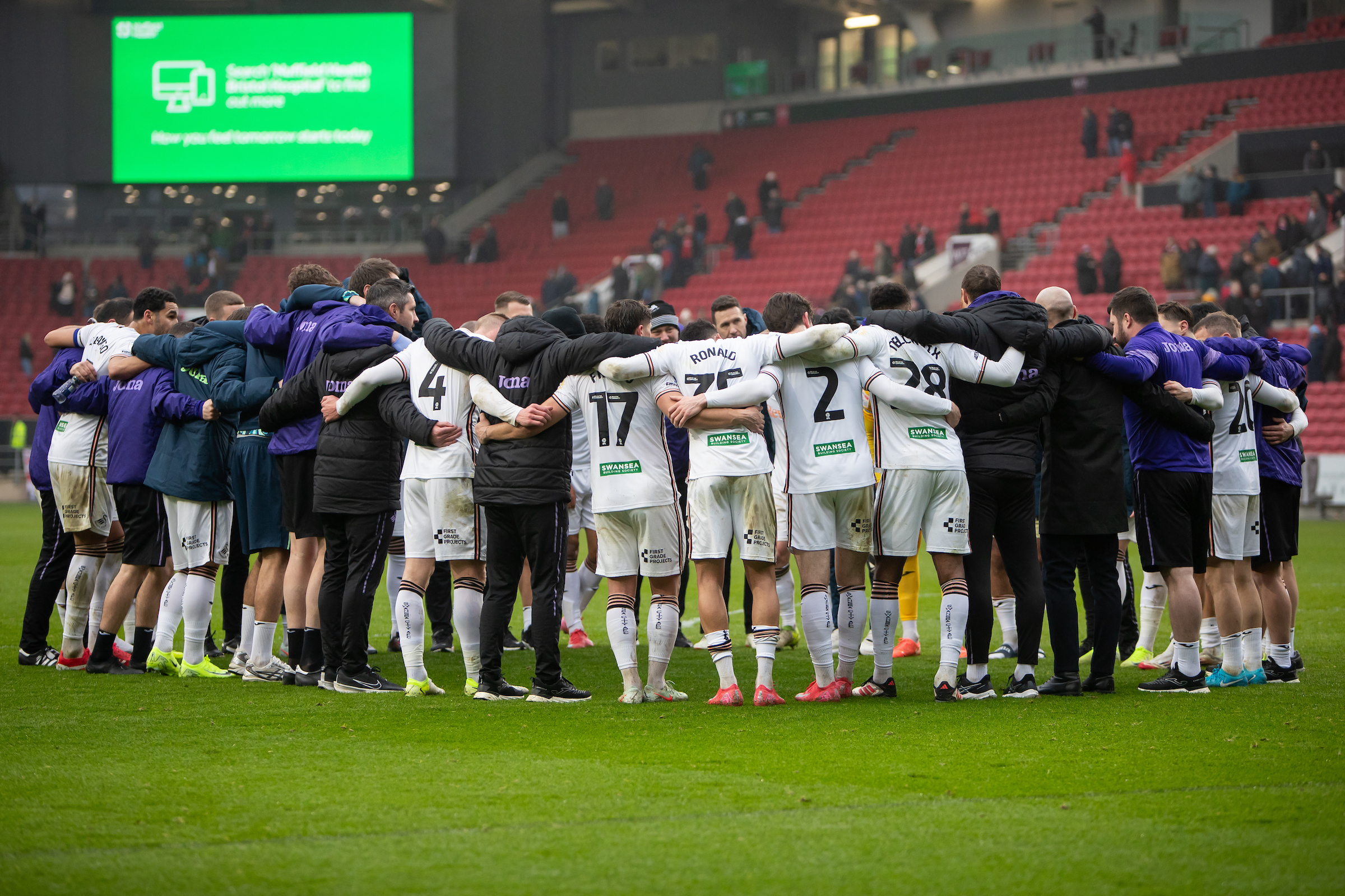 Swansea City huddle